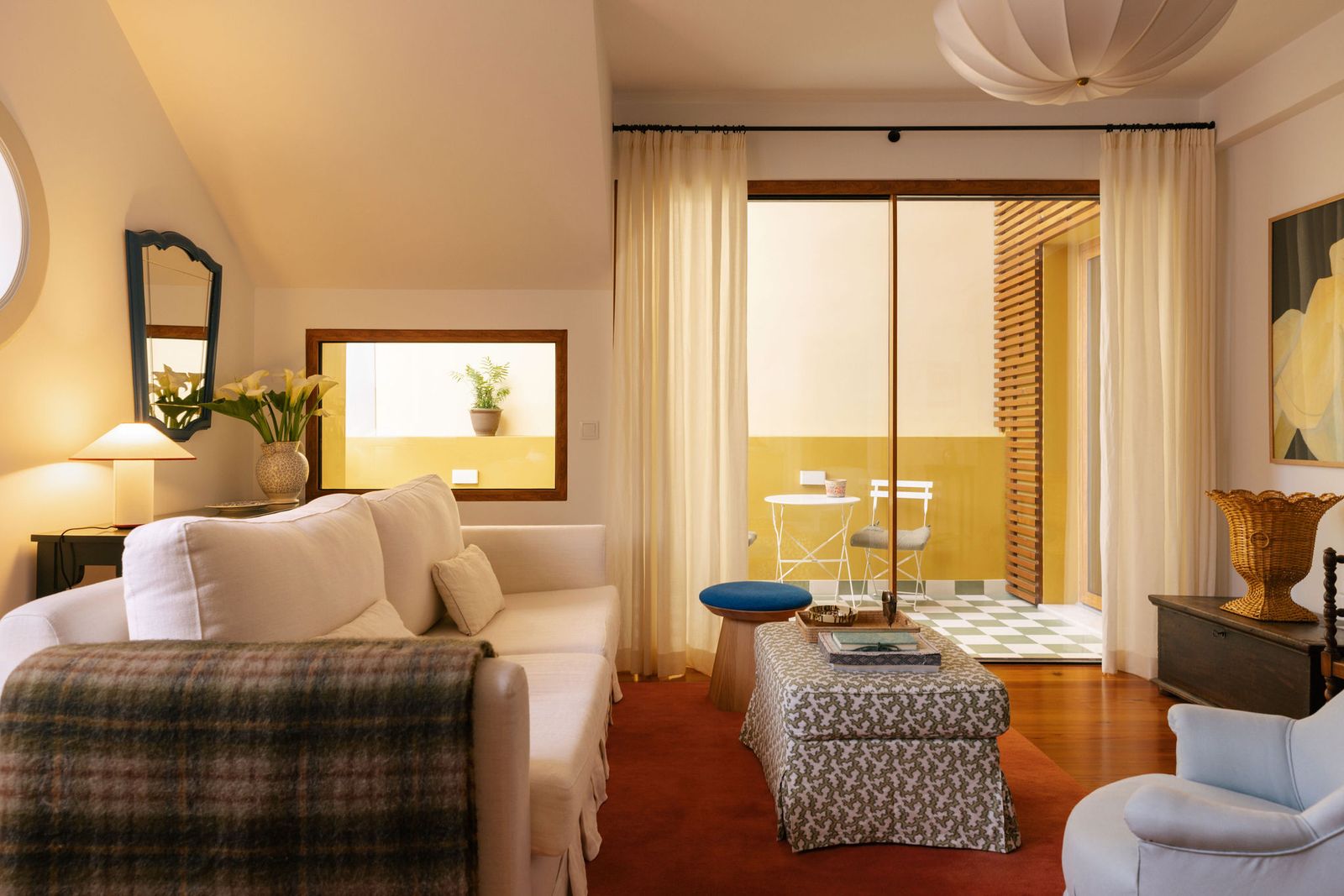 Image may contain Lamp Chair Furniture Home Decor Architecture Building Indoors Living Room Room Plant and Desk