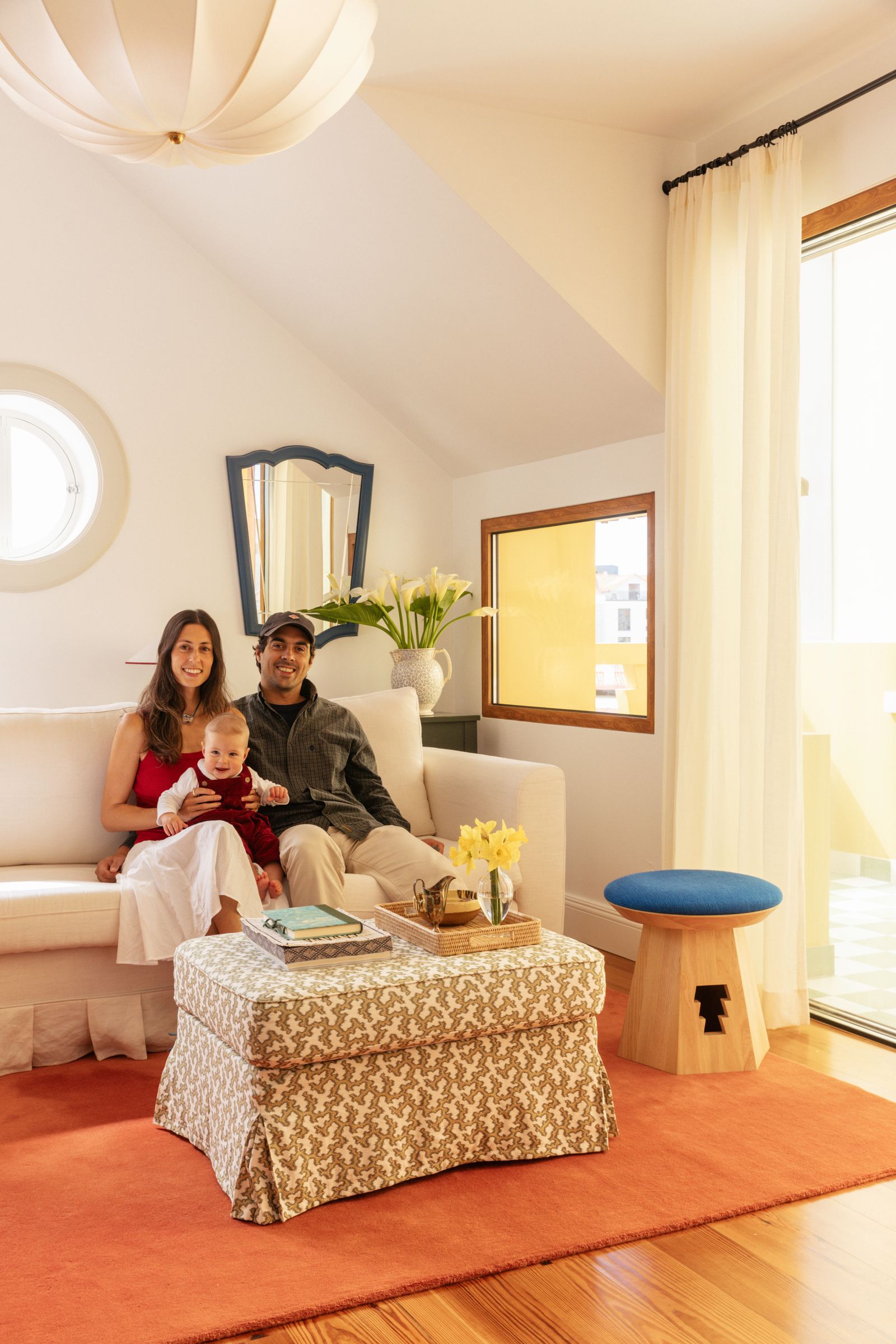 Image may contain Home Decor Couch Furniture Baby Person Lamp Adult Book Publication Architecture and Building