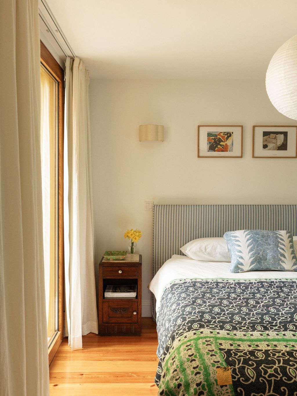 Image may contain Indoors Interior Design Art Painting Bed Furniture Home Decor Cushion Lamp Corner and Bedroom