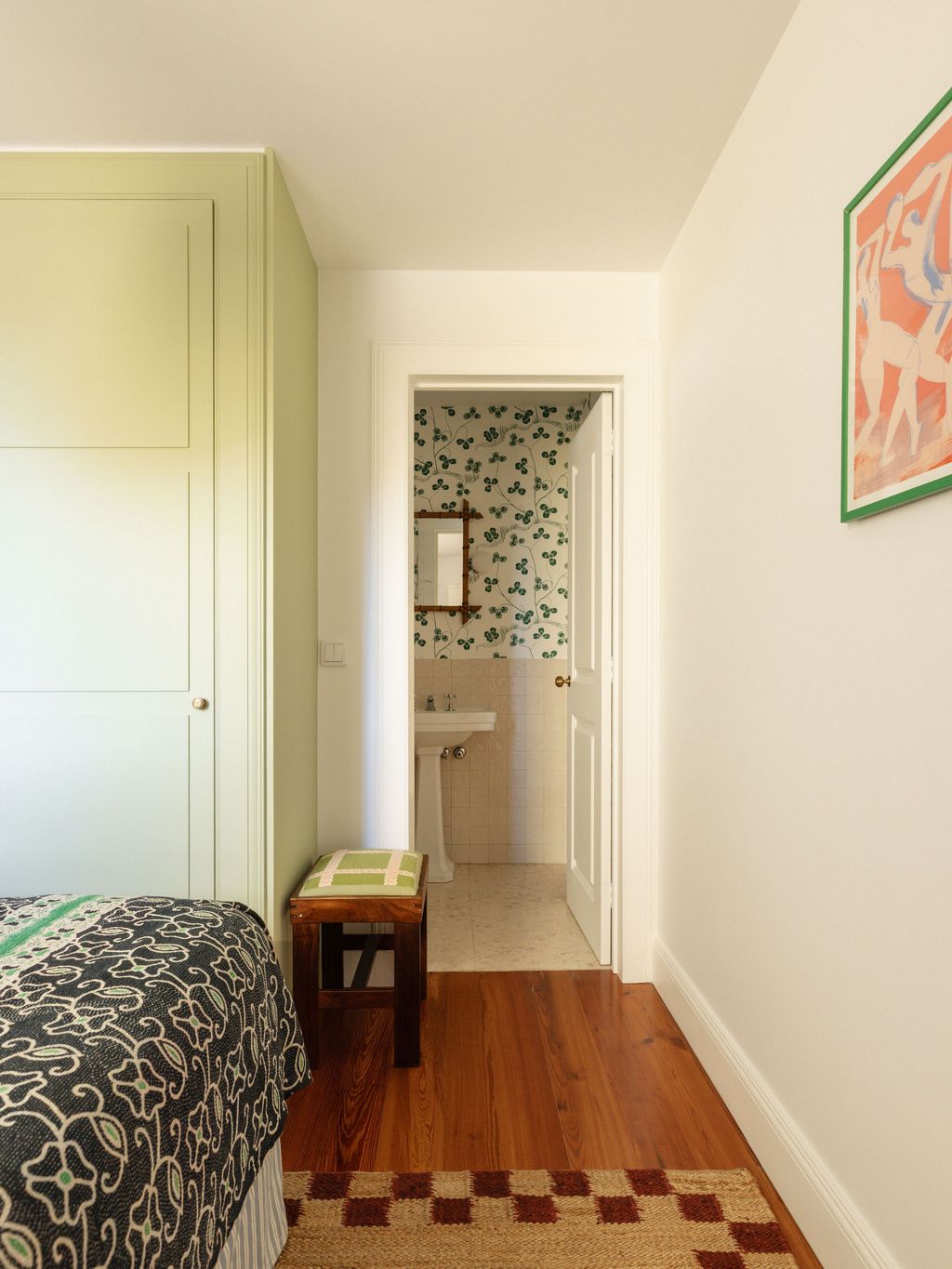 Image may contain Corner Indoors Interior Design Home Decor Rug Bed Furniture Sink Floor Flooring and Bedroom