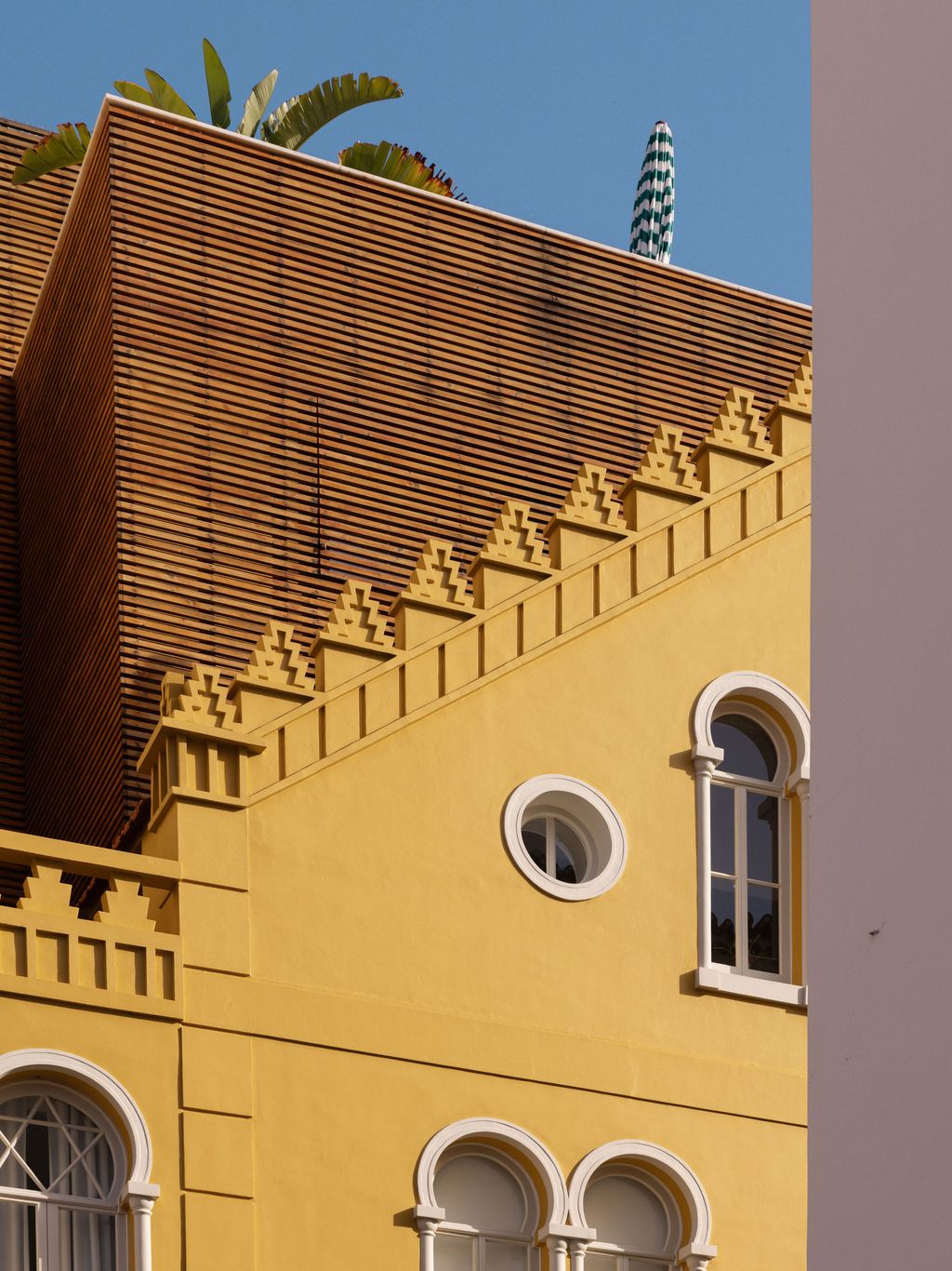 Image may contain Architecture Building Brick City House Housing Roof Window and Arch