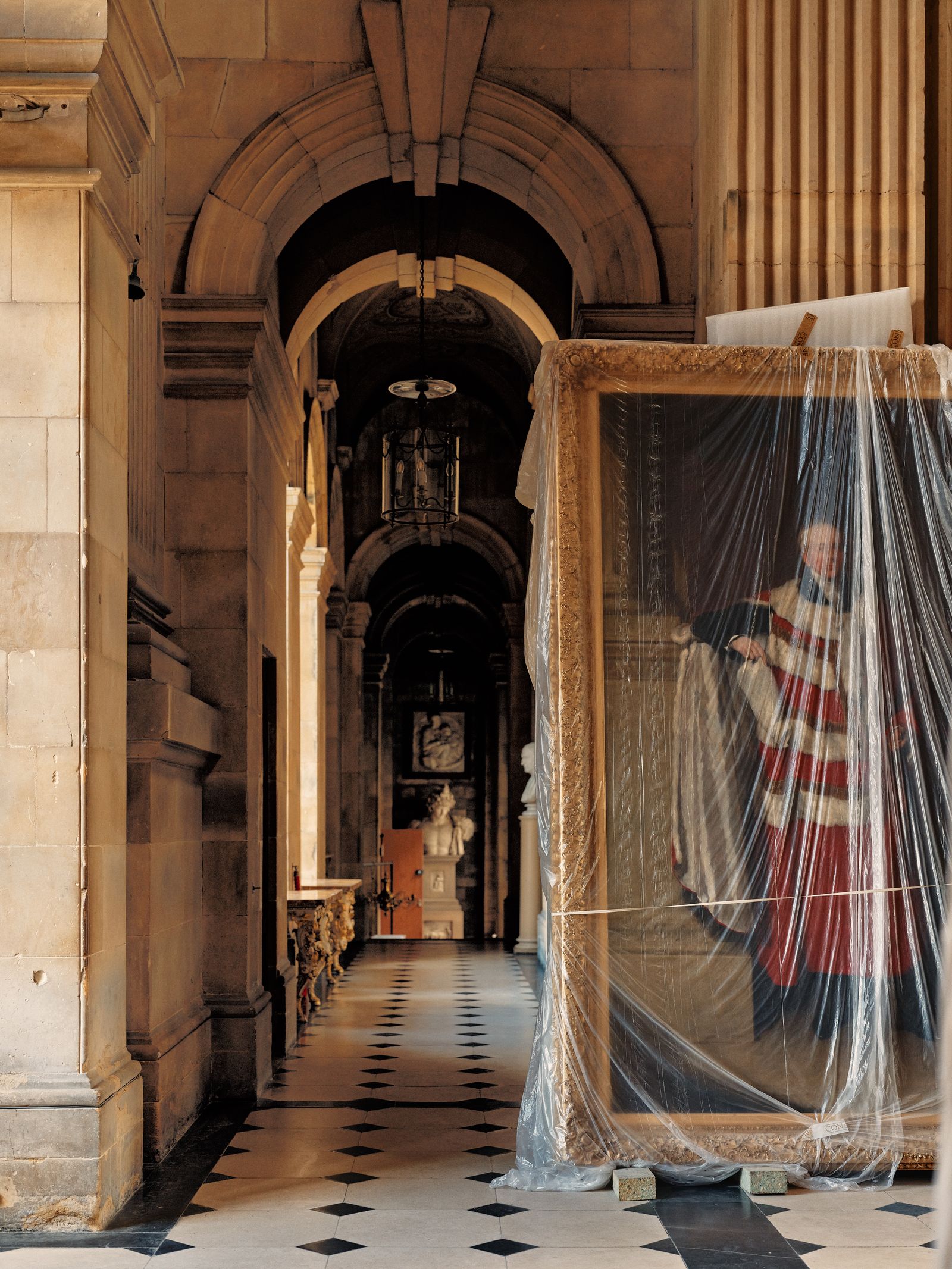 Image may contain Architecture Building Corridor Indoors Floor Flooring Aisle Adult Person Wedding and Crypt