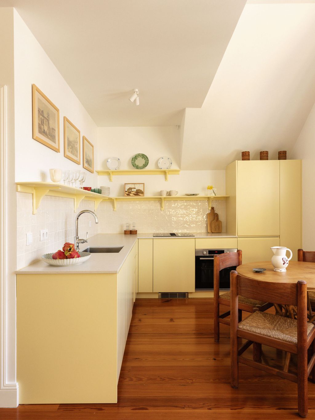 Image may contain Indoors Kitchen Sink Sink Faucet Interior Design Chair Furniture Wood Art Painting and Plate