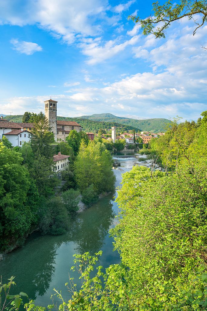 Image may contain Green Plant Vegetation Nature Outdoors Scenery Landscape Tree Land Woodland Water Lake and Sky