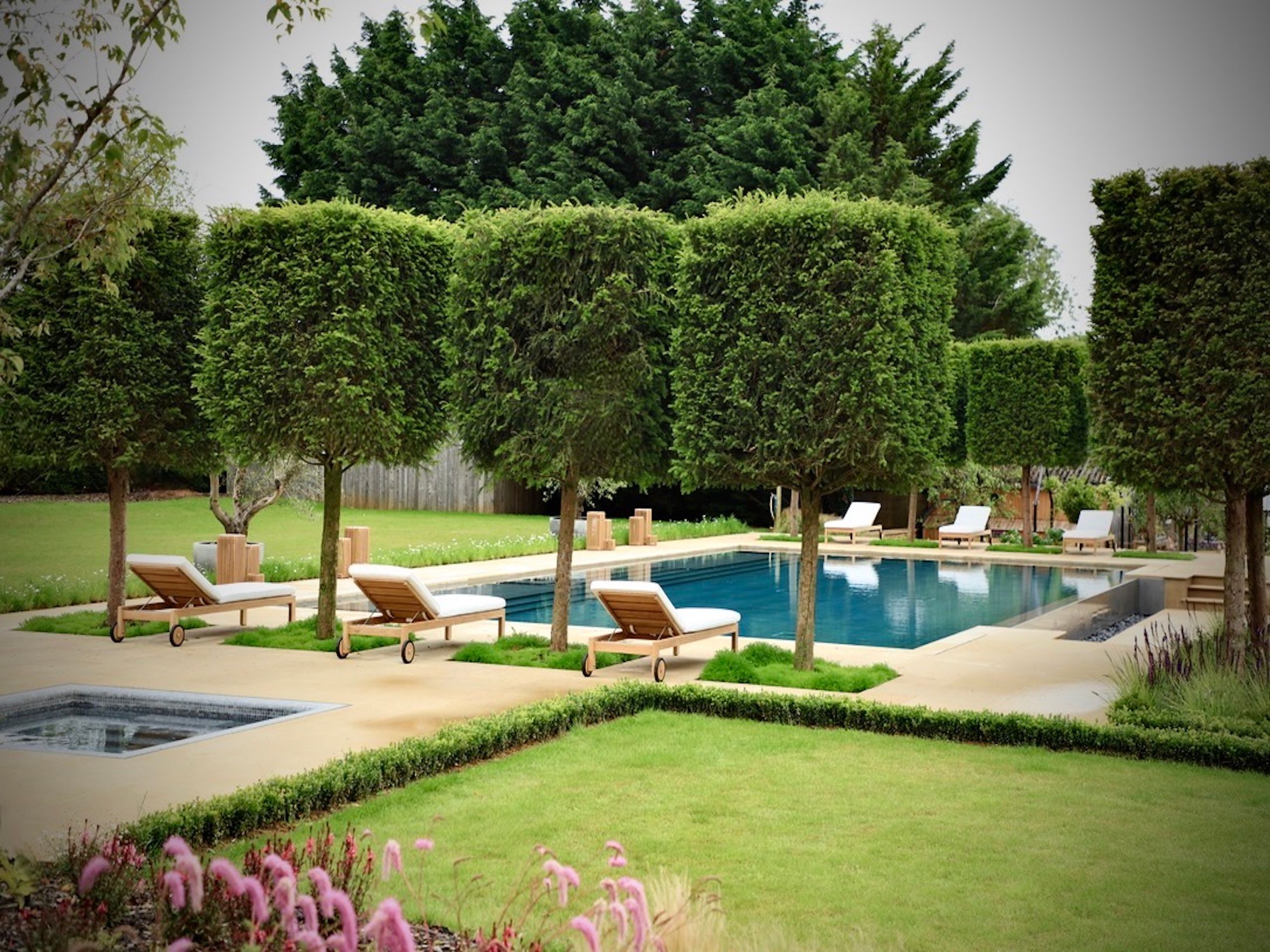 Image may contain: Backyard, Nature, Outdoors, Yard, Grass, Plant, Garden, Fence, Hedge, Chair, Furniture, Park, and Tree