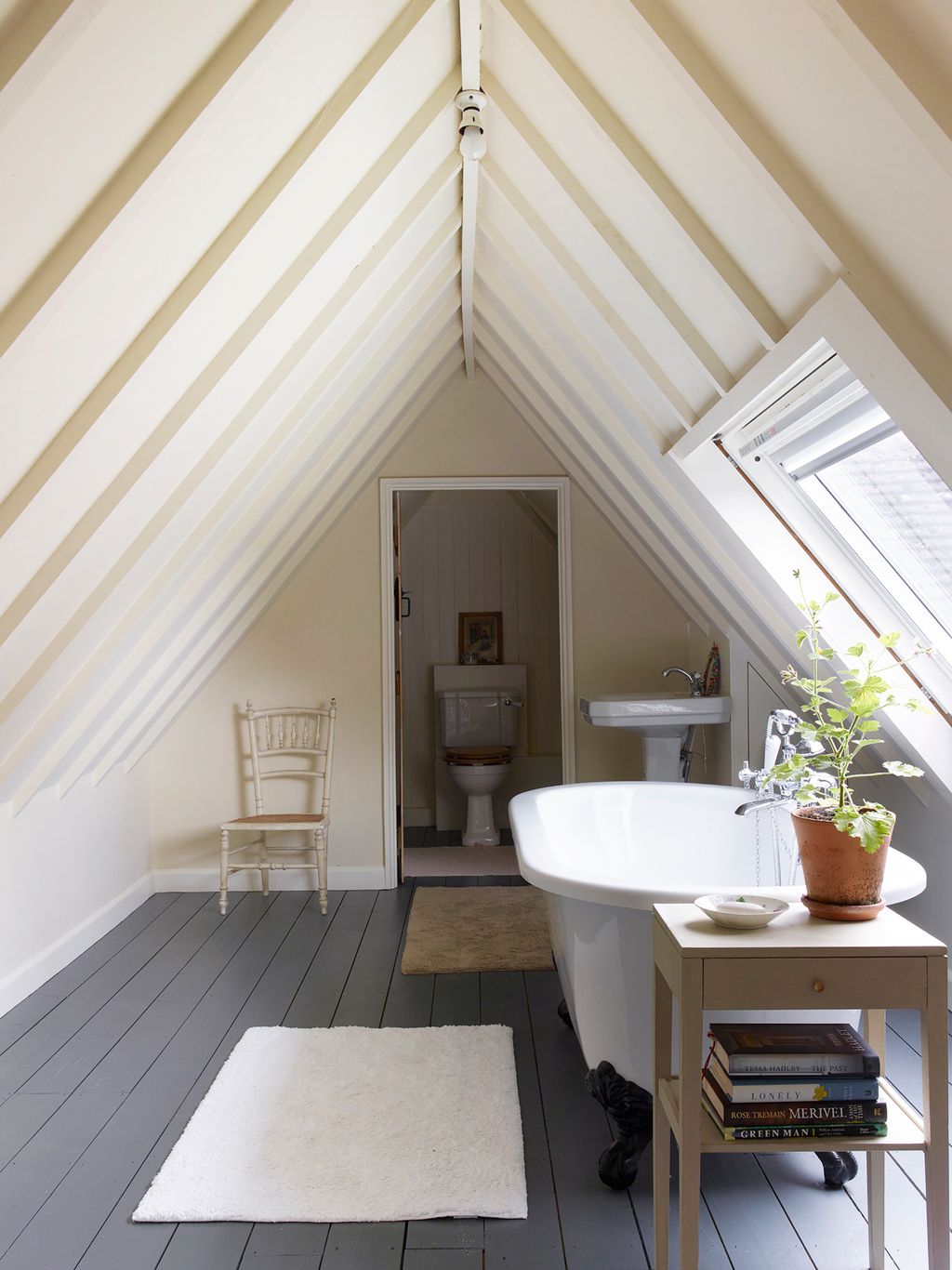 Image may contain Architecture Building House Housing Indoors Loft Room Chair Furniture Home Decor and Rug