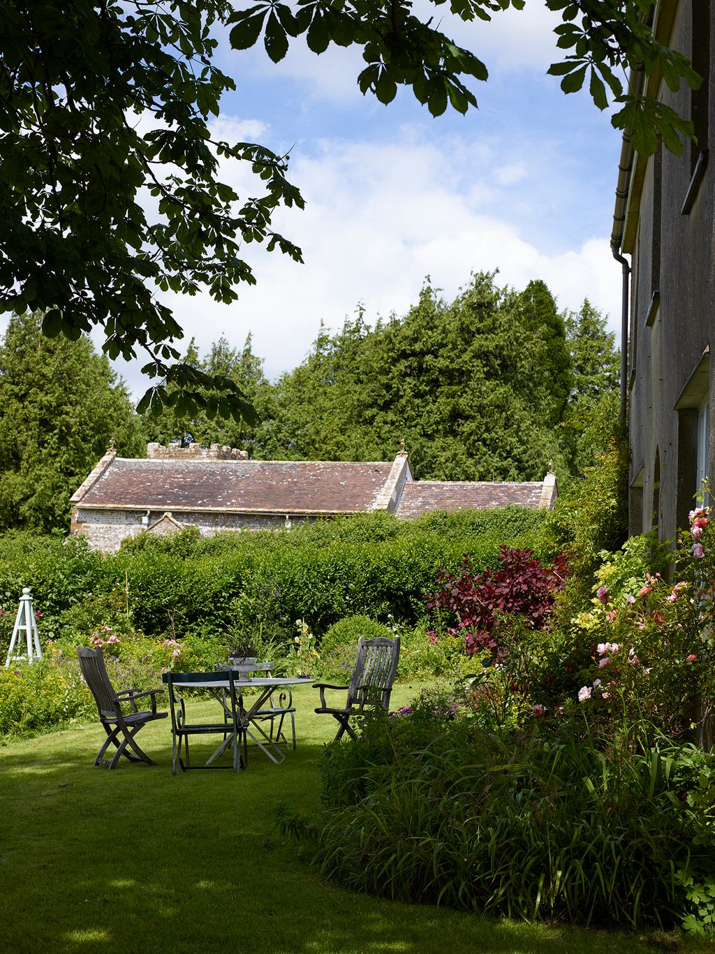 Image may contain Grass Plant Architecture Building Cottage House Housing Garden Nature Outdoors and Backyard