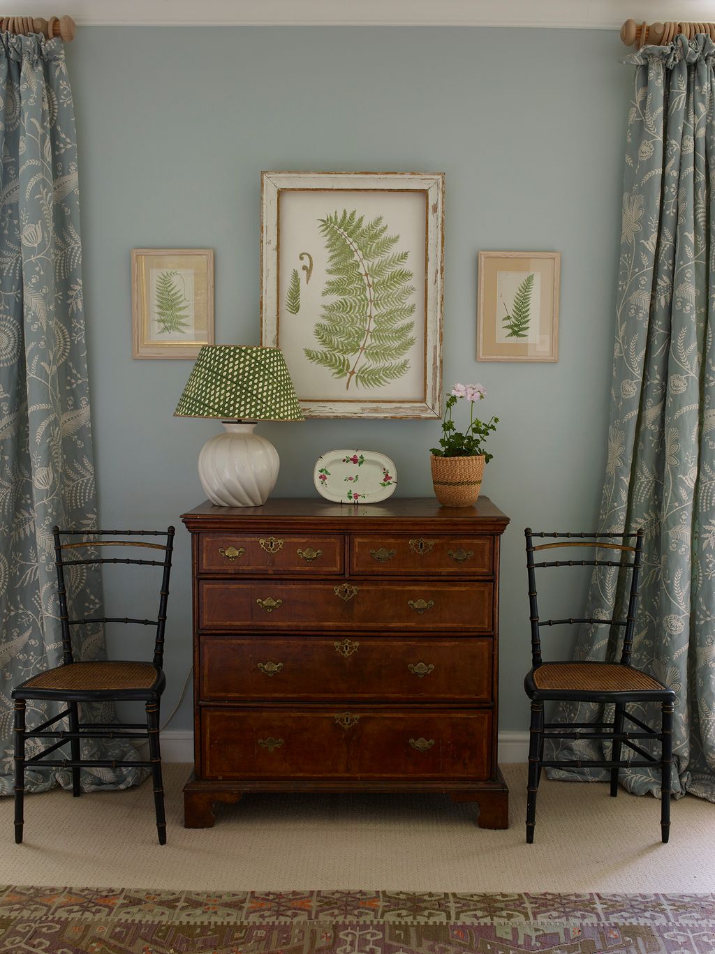 Image may contain Lamp Furniture Chair Art Painting Plate Cabinet Home Decor Rug and Chest Of Drawers