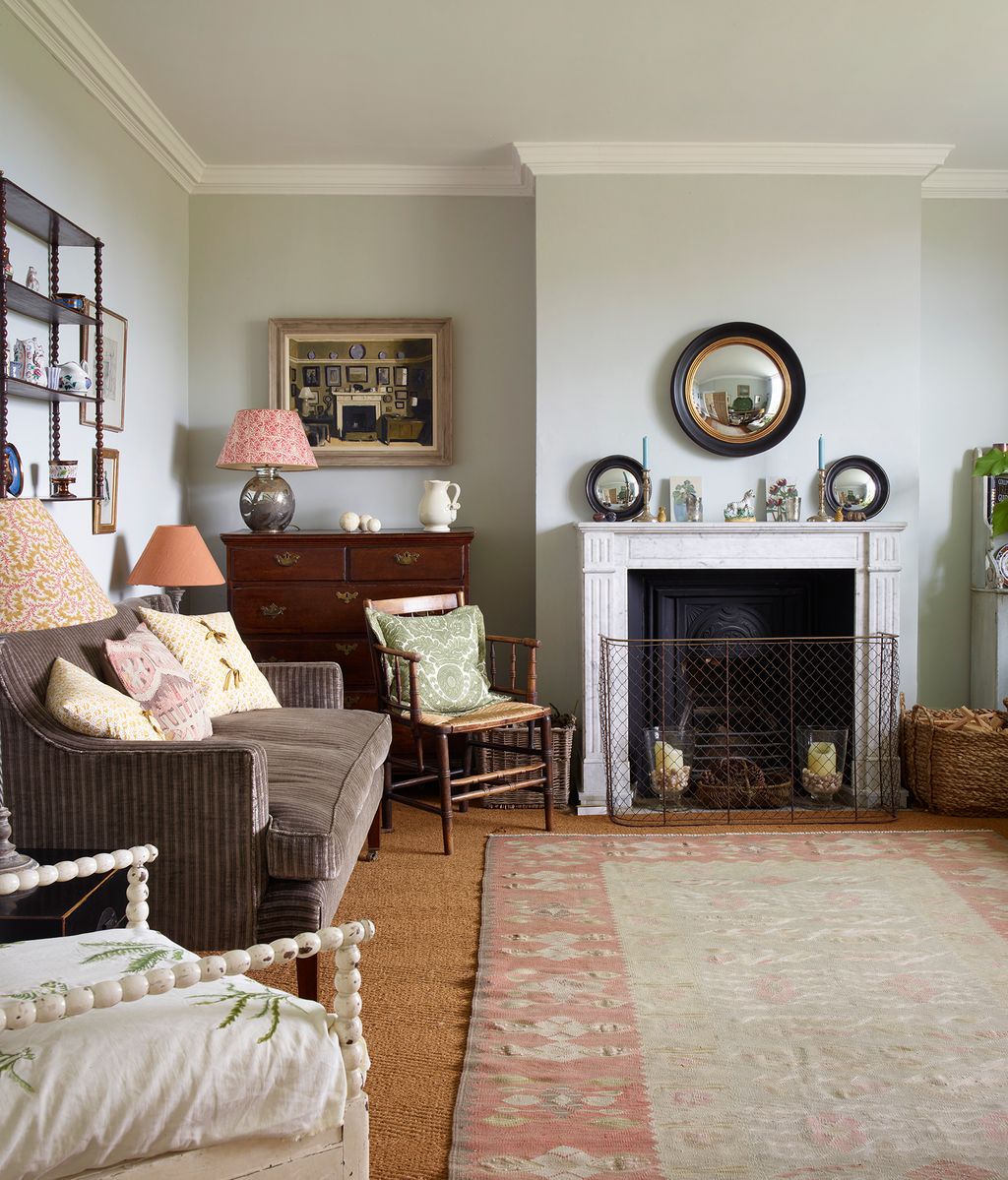 Image may contain Home Decor Lamp Chair Furniture Rug Art Painting Couch Architecture Building and Indoors