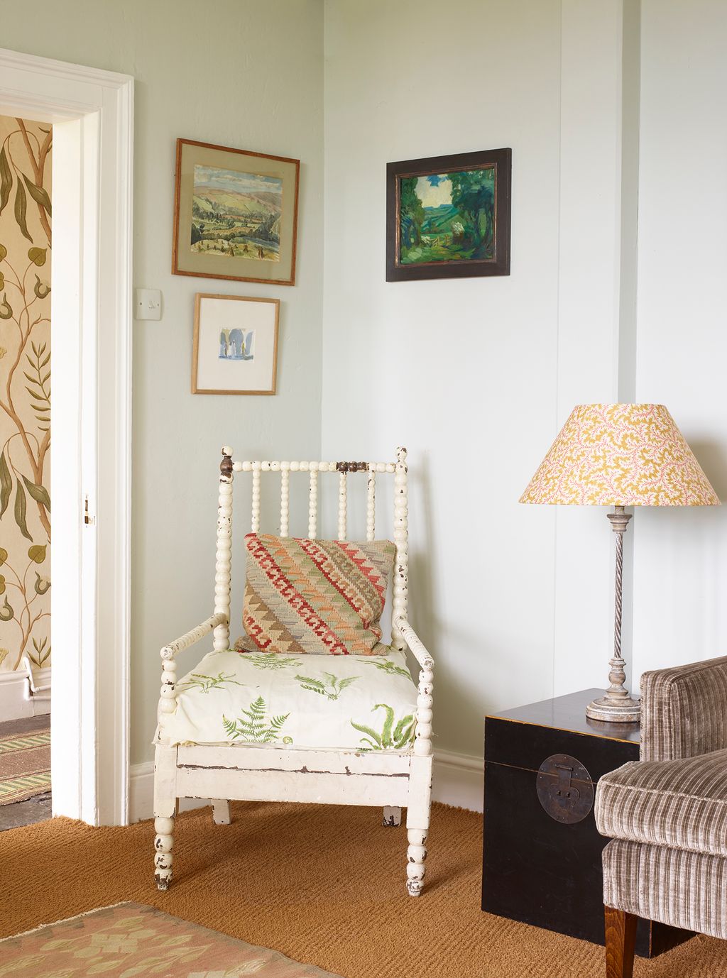 Image may contain Chair Furniture Lamp Art Painting Home Decor Cushion and Rug