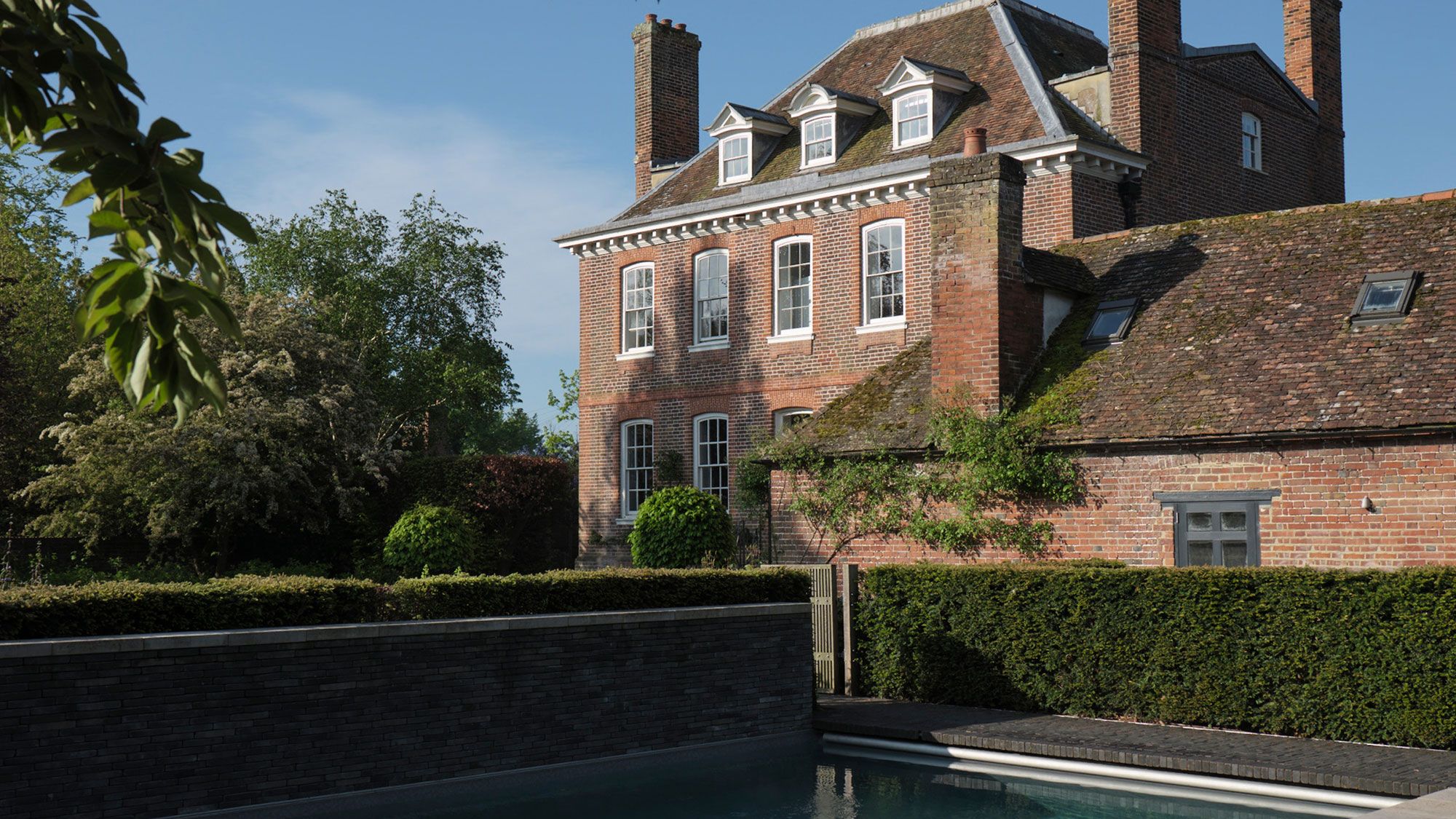 Image may contain: Architecture, Building, House, Housing, Villa, Manor, and Water