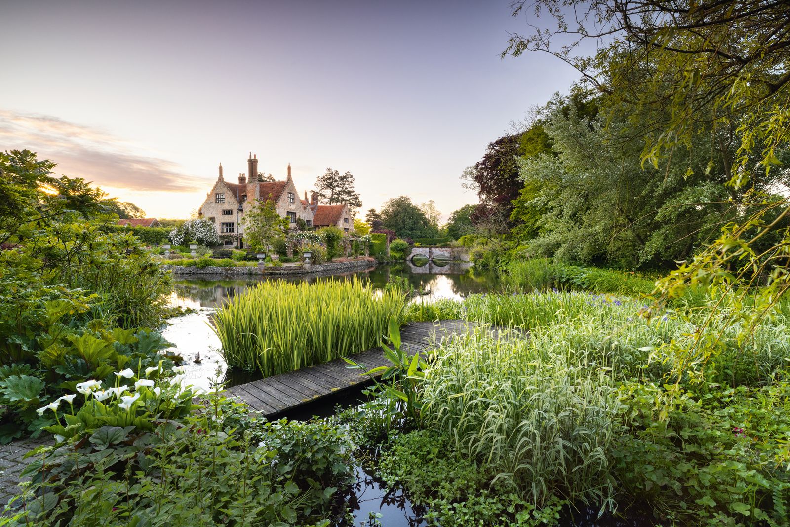 Image may contain Nature Outdoors Pond Water Scenery Landscape Architecture Building Housing Castle and Fortress