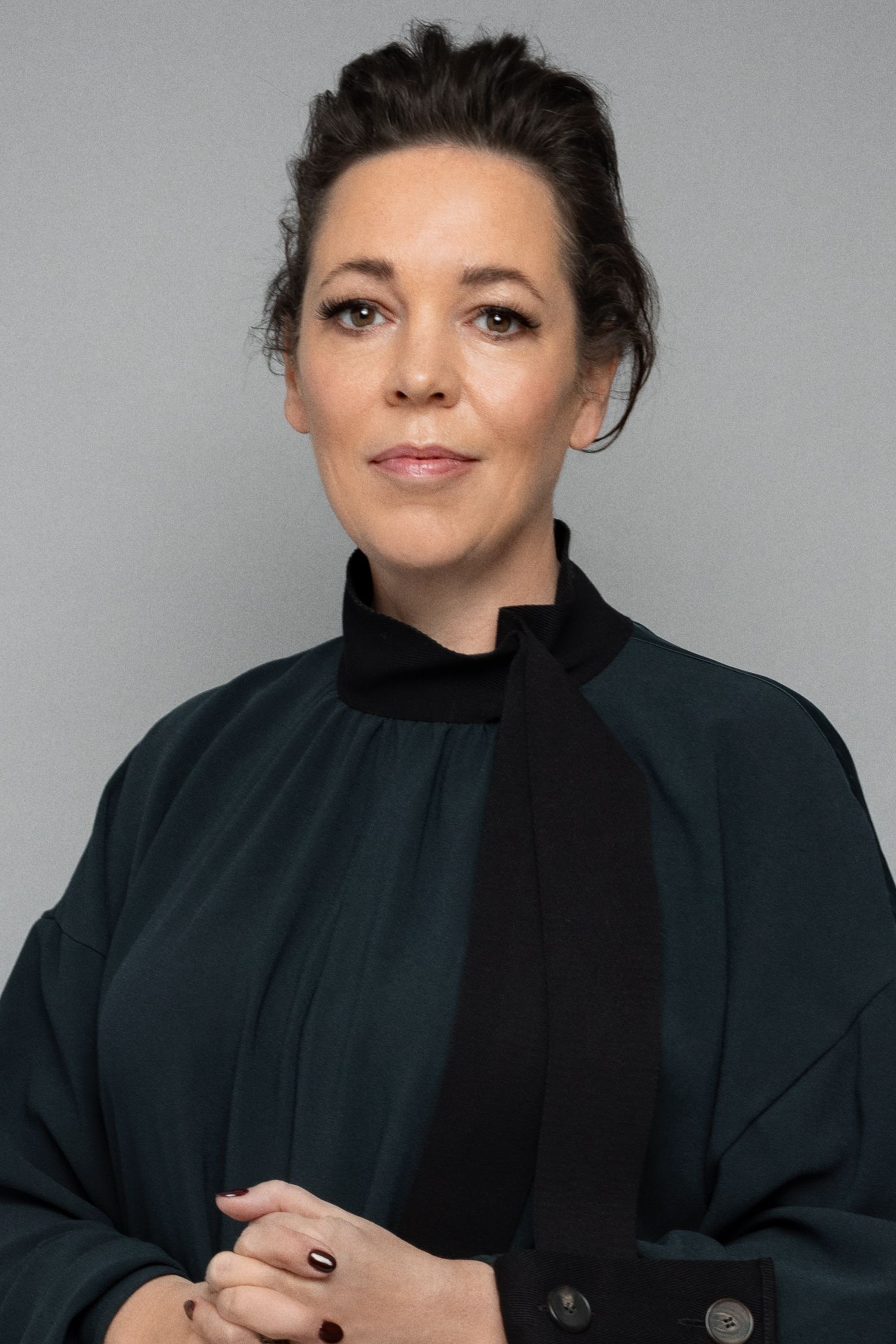 Image may contain Olivia Colman Face Head Person Photography Portrait Adult and Judge