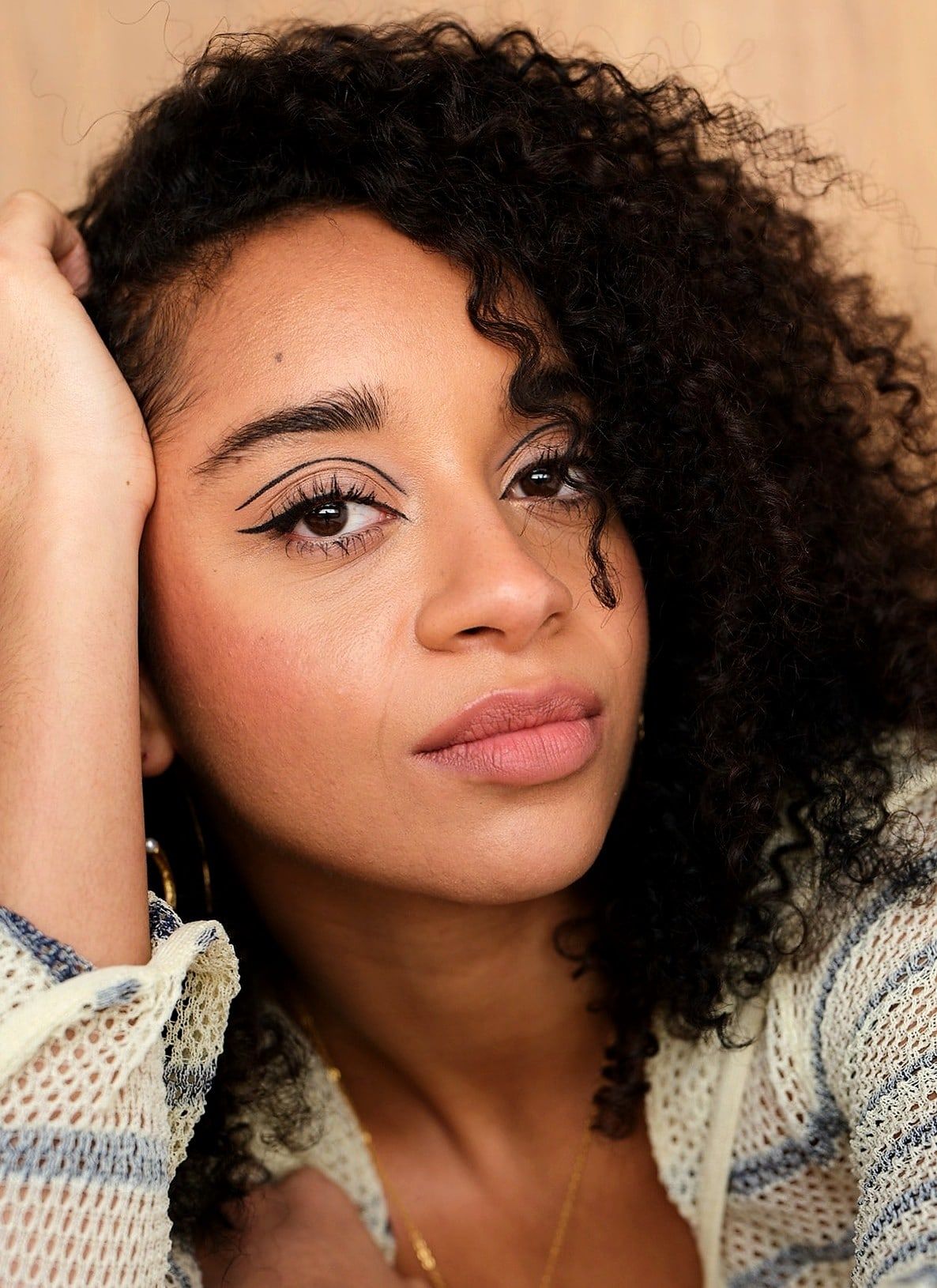 Image may contain Head Person Face Adult Accessories Jewelry Necklace Photography Portrait Body Part and Neck