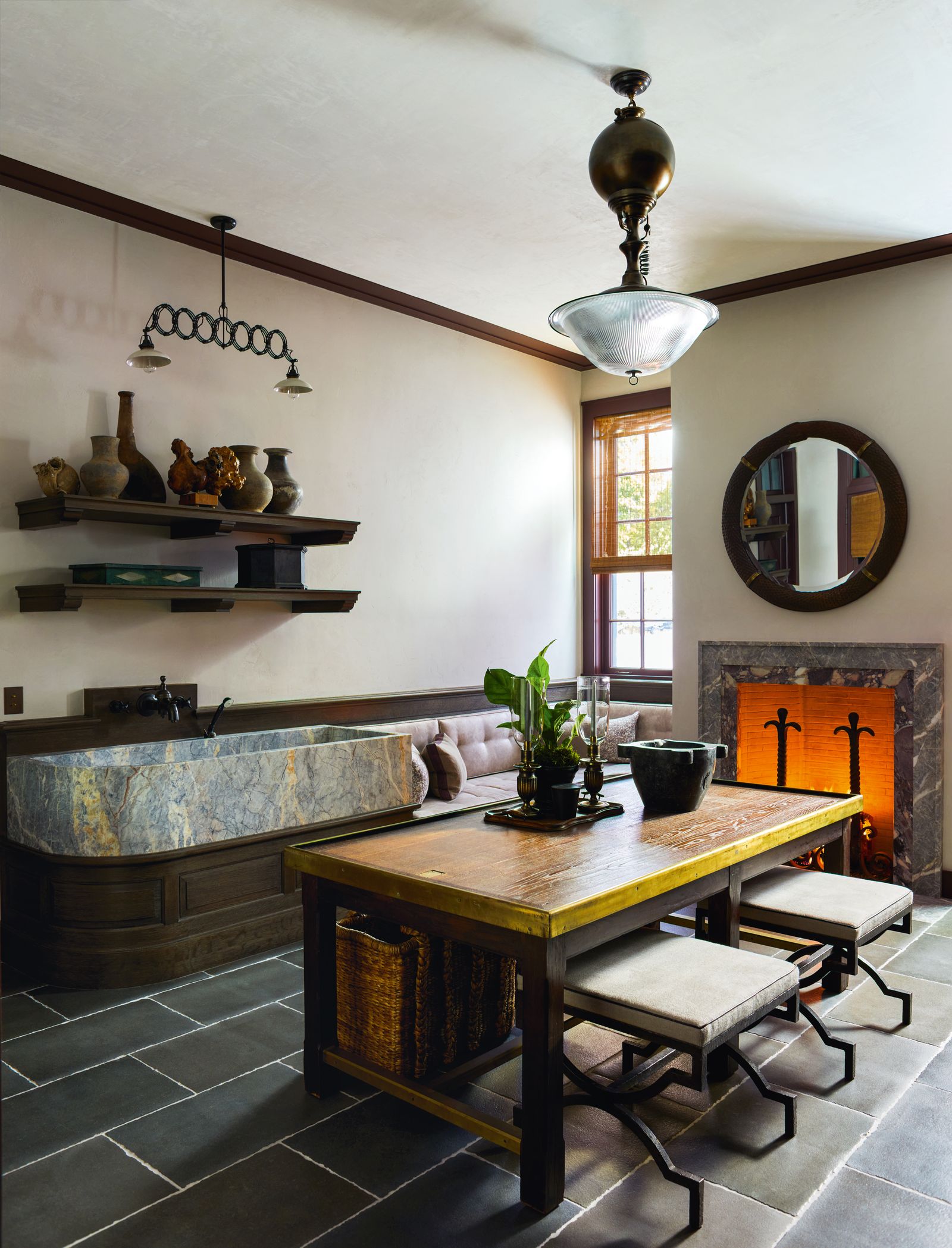 Image may contain Indoors Interior Design Lamp Plant Desk Furniture Table Architecture Building and Dining Room