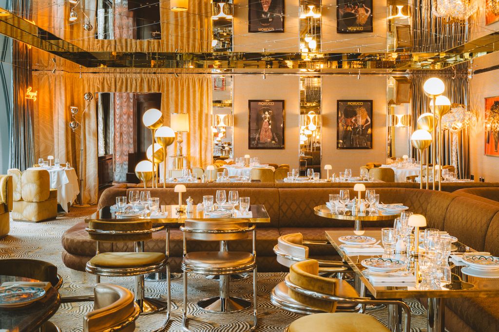 Image may contain Indoors Architecture Building Dining Room Dining Table Furniture Room Table Chair and Art