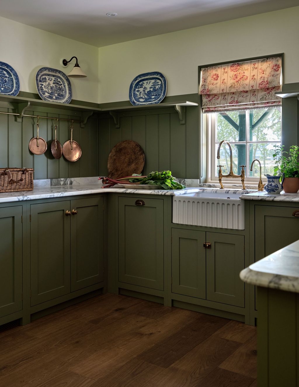 Image may contain Indoors Interior Design Lamp Kitchen Plant Sink Sink Faucet Plate and Kitchen Island