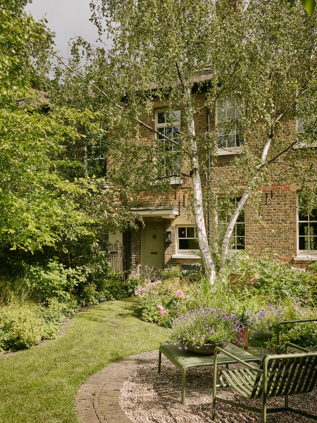 Image may contain Architecture Building Cottage House Housing Grass Plant Tree Garden Nature and Outdoors