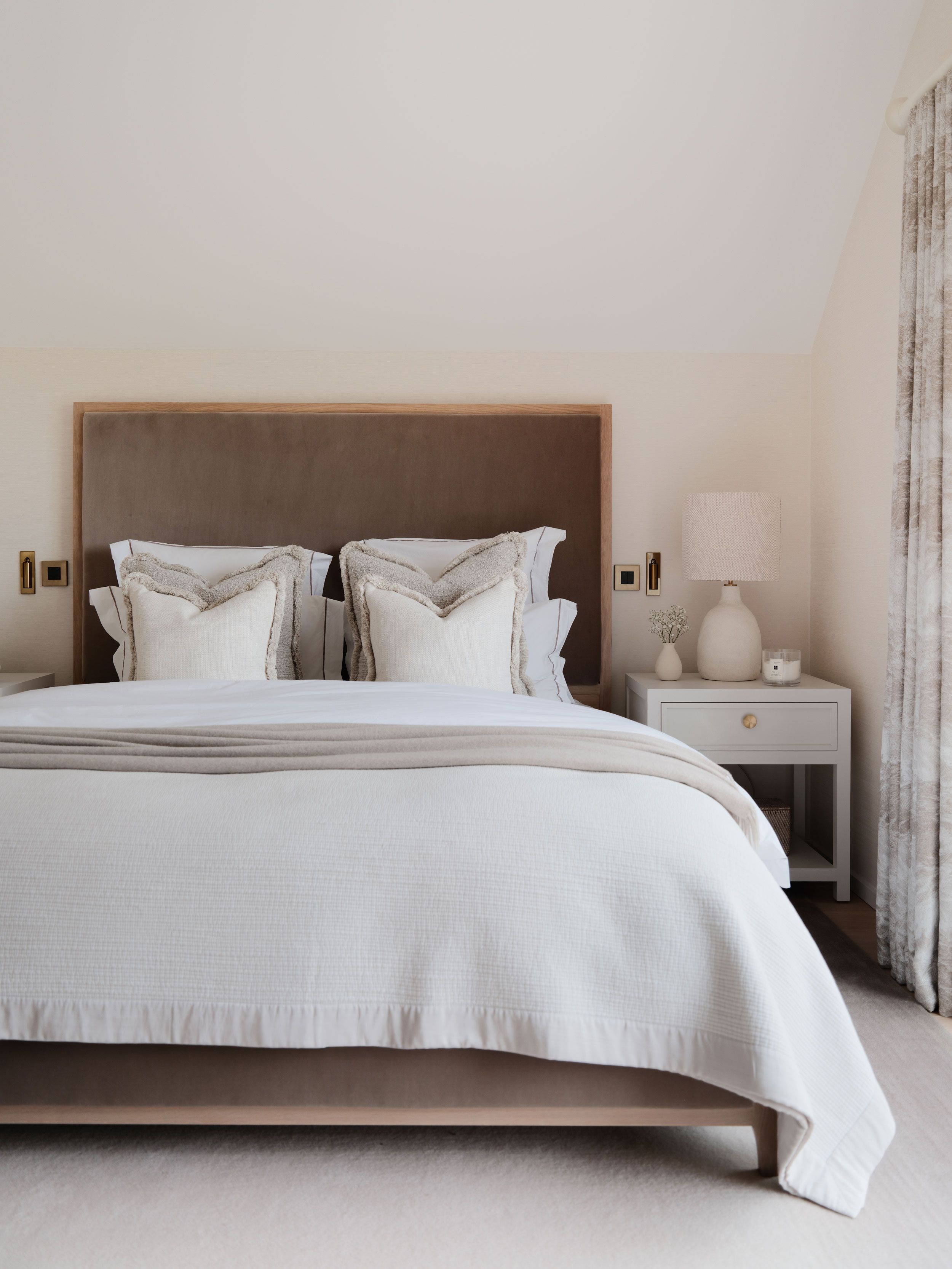 Image may contain: Cushion, Home Decor, Bed, Furniture, Lamp, Indoors, Interior Design, Pillow, Plant, Bedroom, and Room