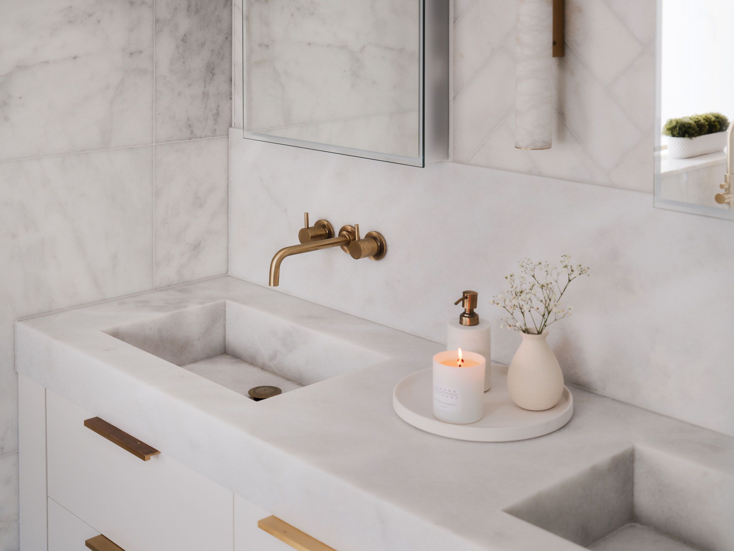 Image may contain: Sink, Sink Faucet, Candle, and Plant