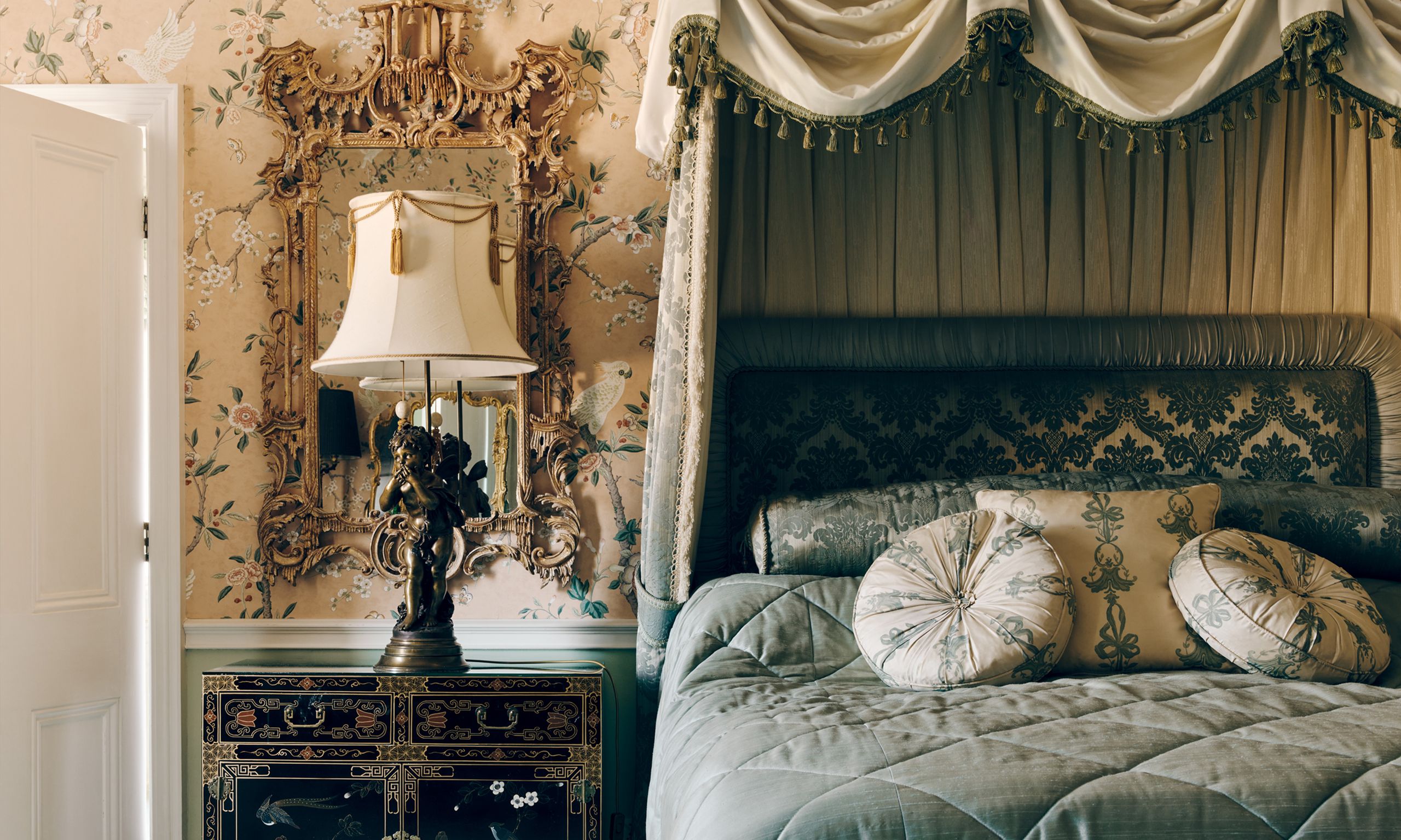 Image may contain: Lamp, Cushion, Home Decor, Indoors, Furniture, Bed, Bedroom, Room, Interior Design, Person, Couch, and Box