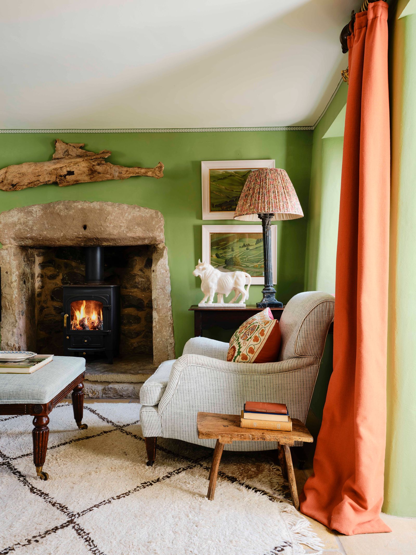 Image may contain Book Publication Lamp Home Decor Fireplace Indoors Furniture Art Painting Couch and Rug