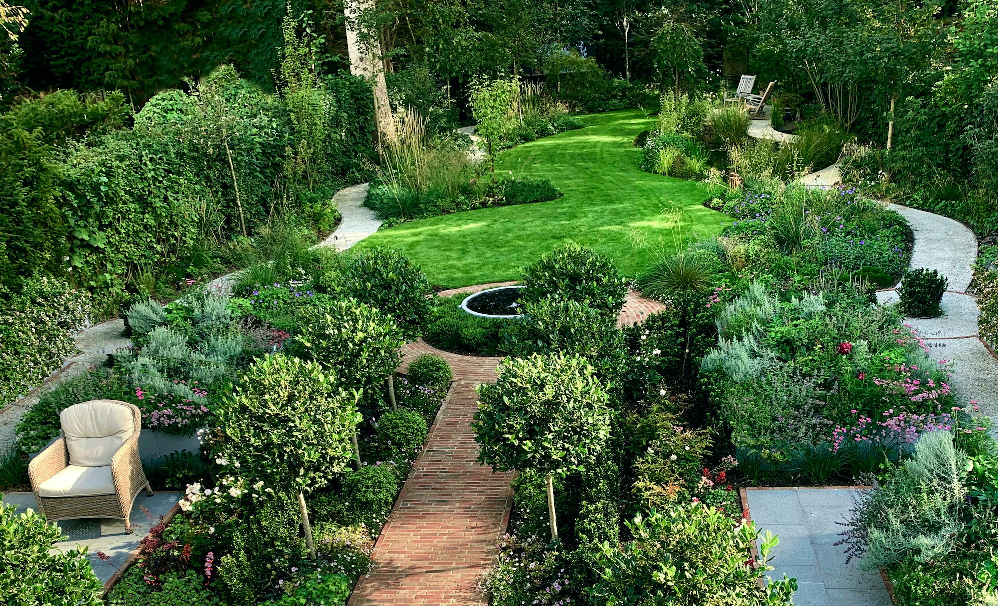 Image may contain: Garden, Nature, Outdoors, Backyard, Yard, Grass, Plant, Park, Chair, Furniture, Lawn, Fence, and Hedge