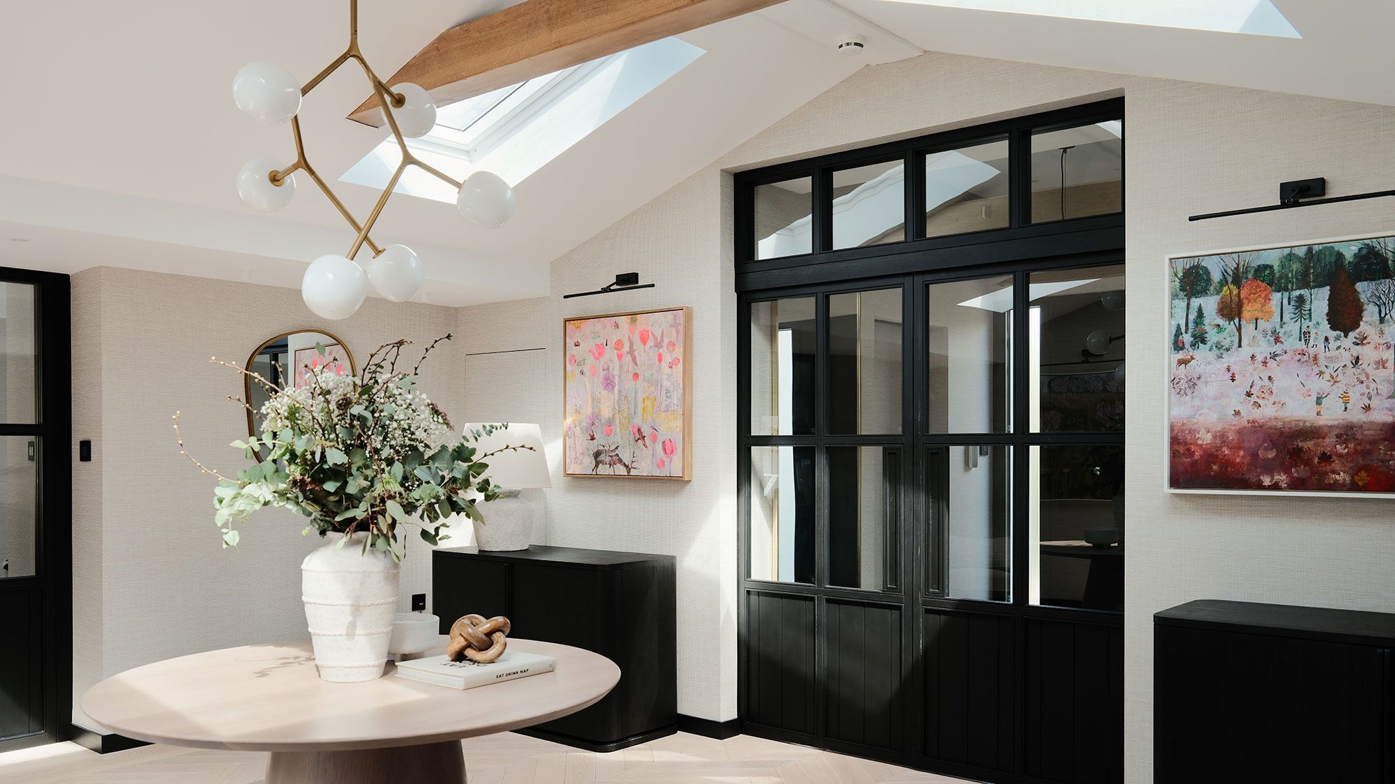 Image may contain: Door, Flower, Flower Arrangement, Plant, Desk, Furniture, Table, Lamp, Indoors, and Interior Design