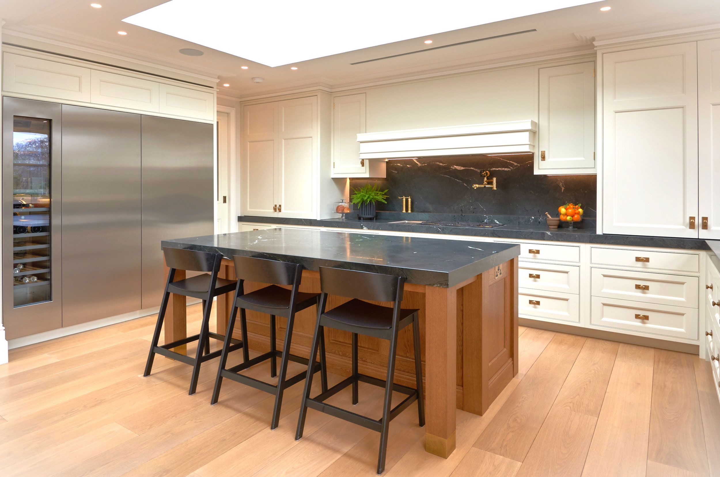 Image may contain: Indoors, Interior Design, Kitchen, Kitchen Island, Plant, Chair, and Furniture