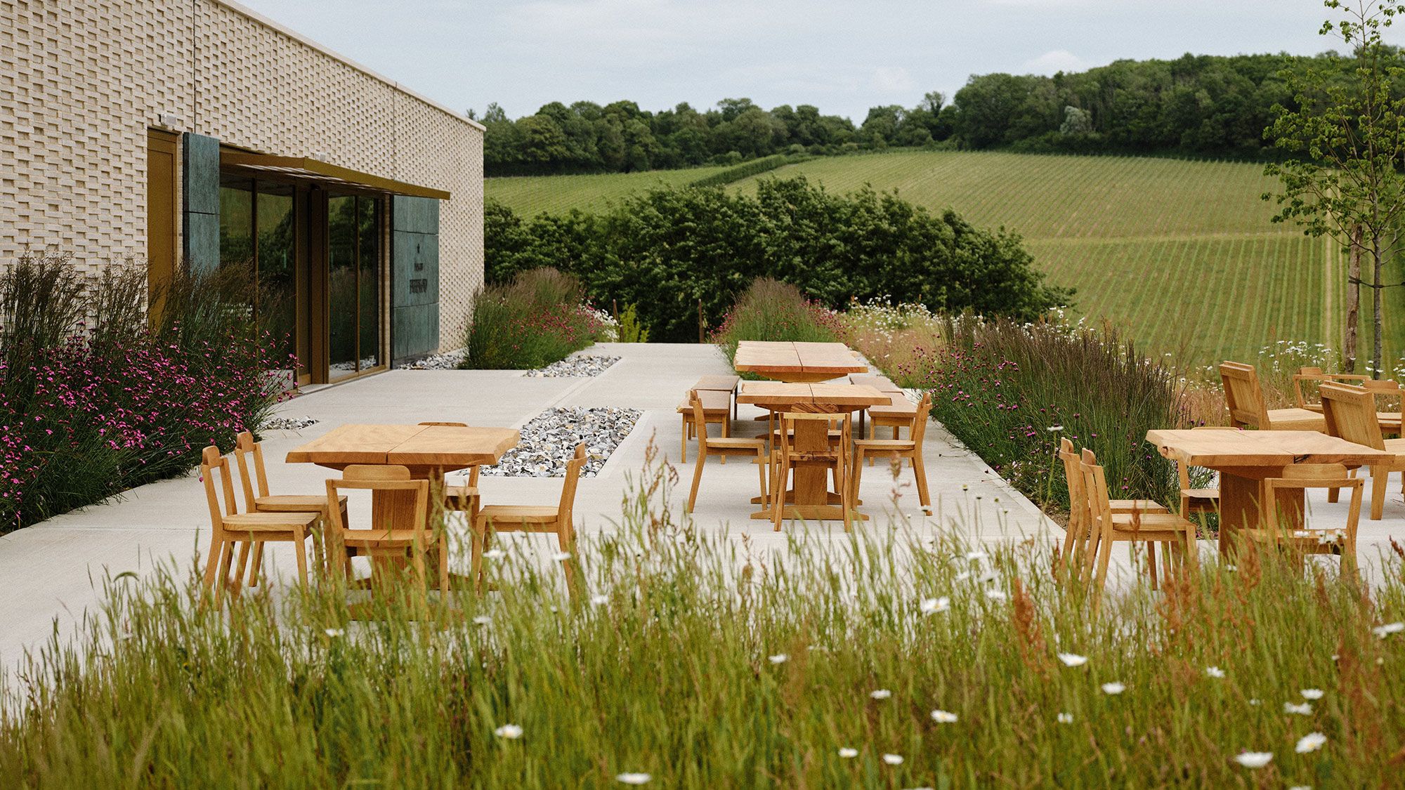 Image may contain: Grass, Plant, Dining Table, Furniture, Table, Indoors, Interior Design, Backyard, Nature, and Outdoors