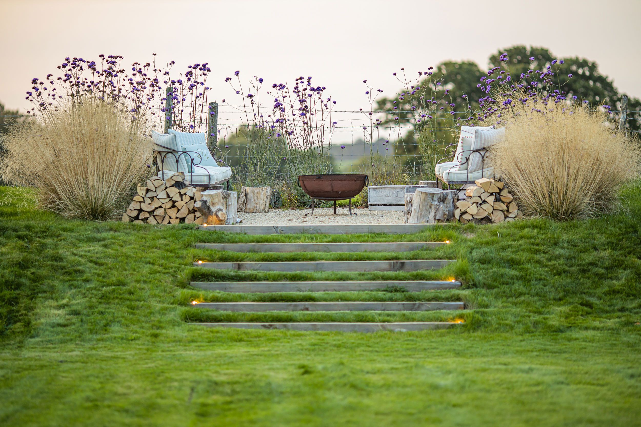 Image may contain: Grass, Plant, Backyard, Nature, Outdoors, Yard, Chair, Furniture, Garden, Lawn, Bench, and Park