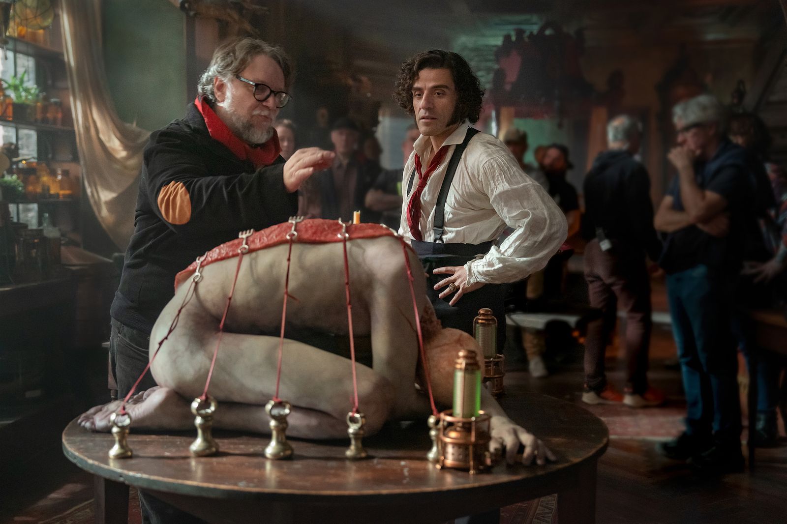 Image may contain Guillermo del Toro Oscar Isaac Teddy Williams Alcohol Bar Bar Counter Beverage Pub and Accessories