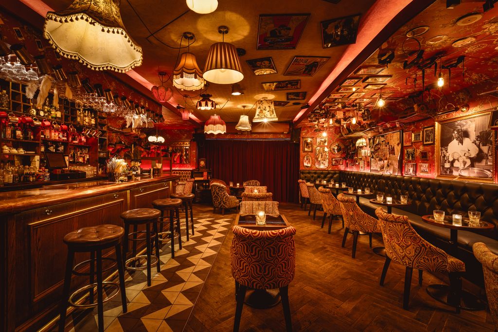 Image may contain Chair Furniture Bar Lamp Cup Person Art Painting Computer Hardware Electronics and Hardware