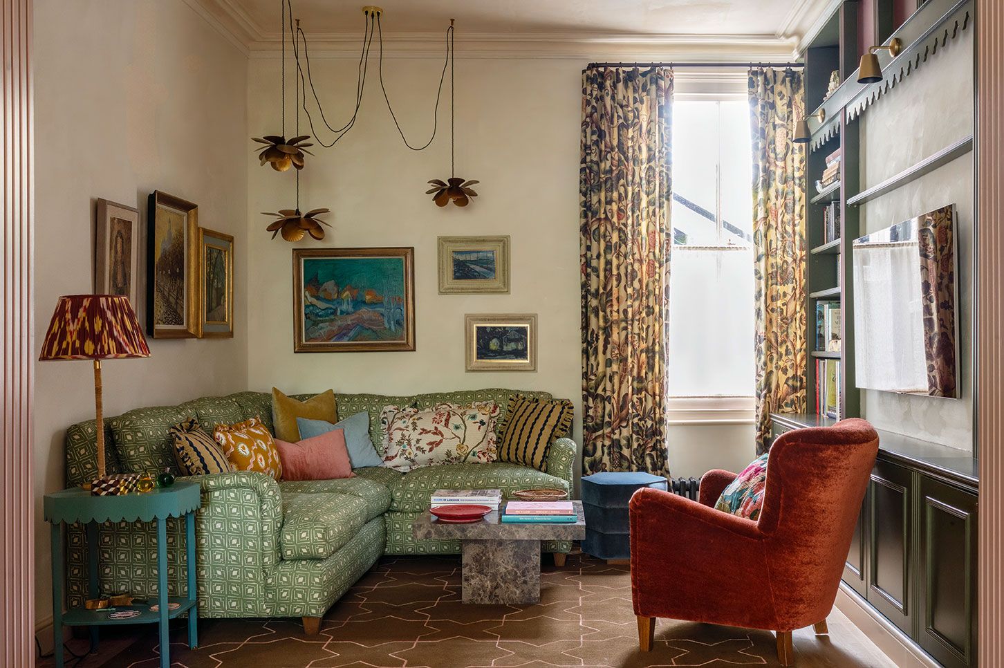 Image may contain: Home Decor, Lamp, Art, Painting, Chair, Furniture, Couch, Architecture, Building, Indoors, and Living Room