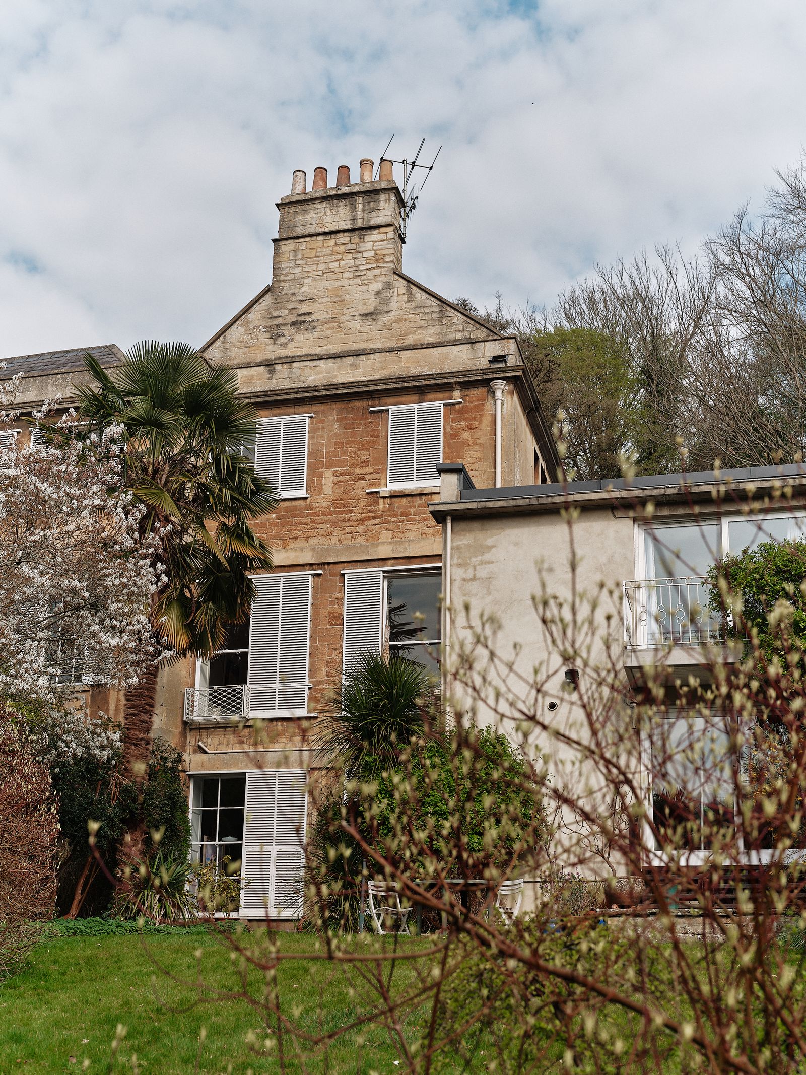 Image may contain Architecture Building Housing House Monastery Chair Furniture Grass and Plant