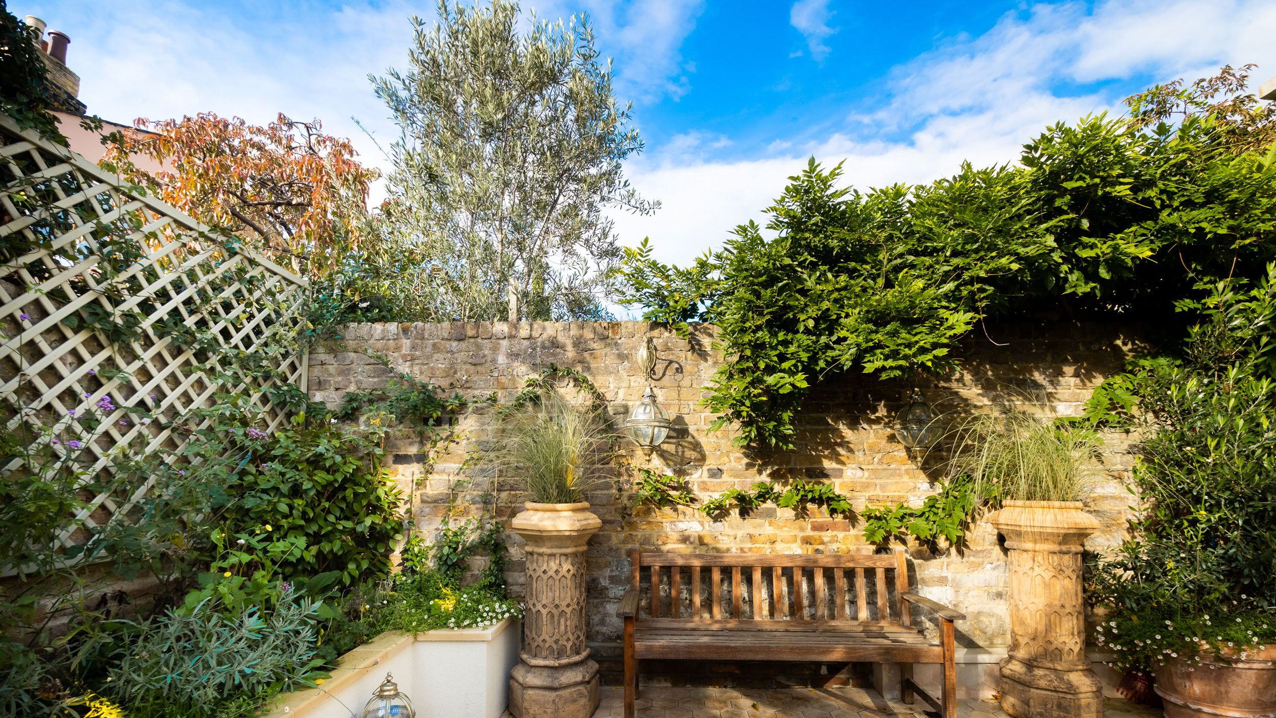 Image may contain: Backyard, Nature, Outdoors, Yard, Garden, Bench, Furniture, Lamp, Plant, Architecture, and Building