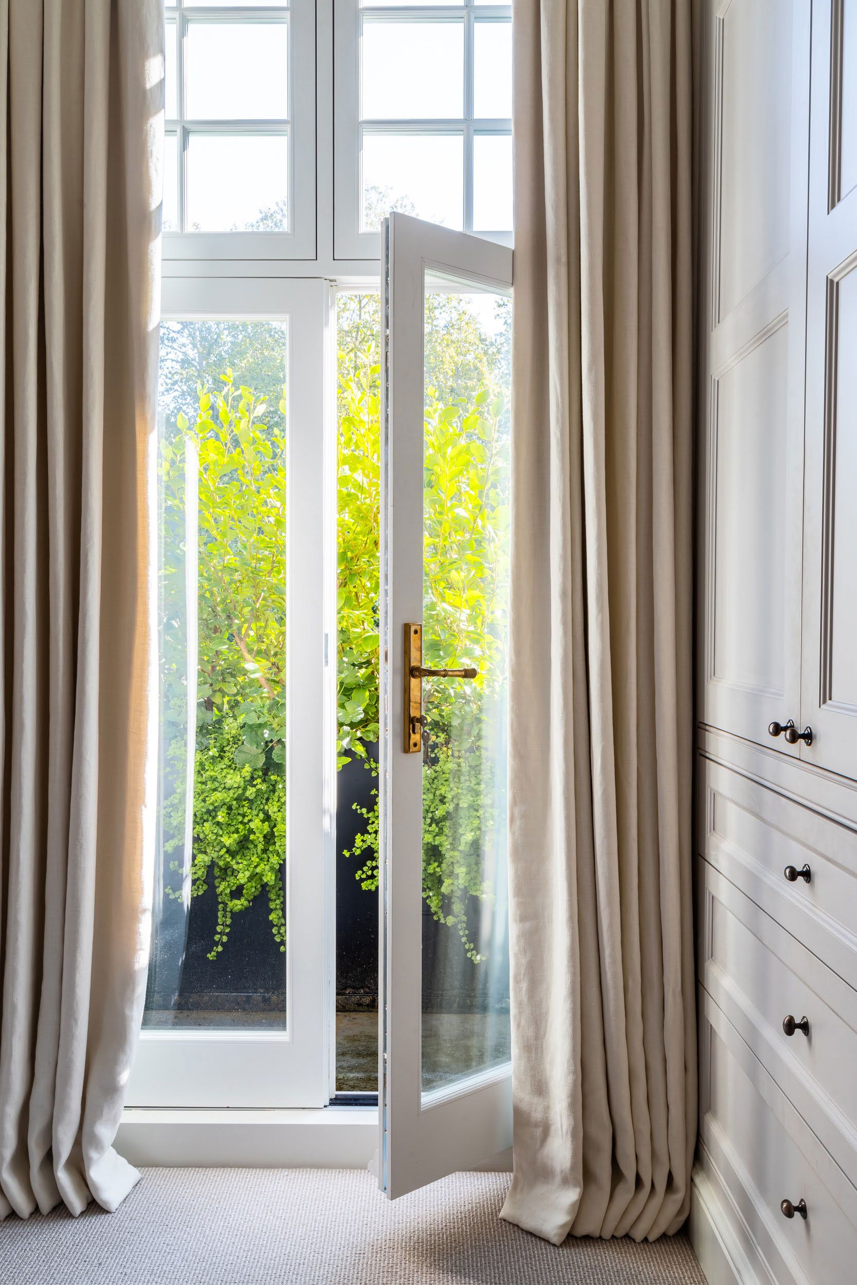 Image may contain: Door, Architecture, Building, Housing, Window, House, and French Window