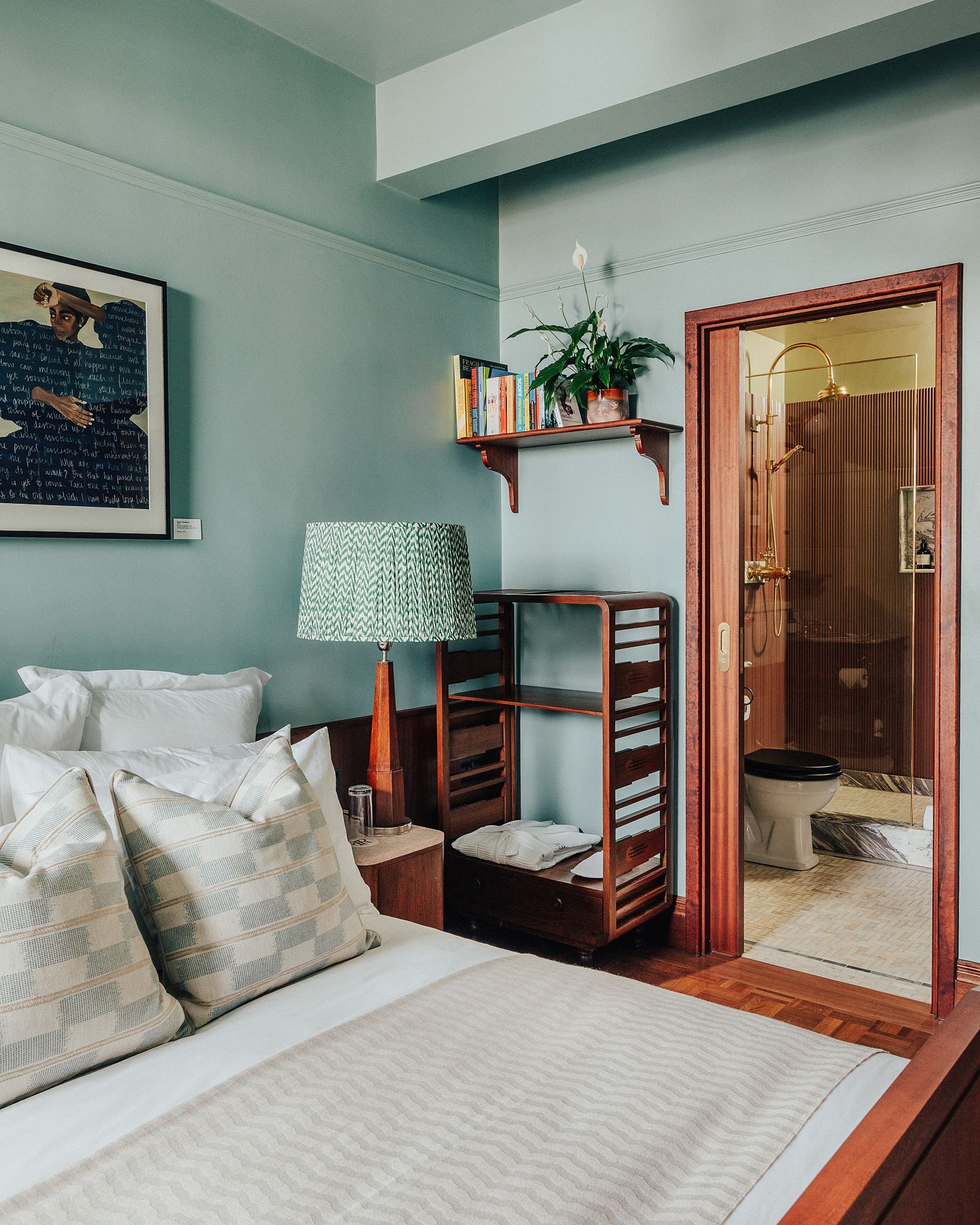 Image may contain Lamp Art Painting Home Decor Cushion Corner Bed Furniture Bathroom Indoors Room and Toilet