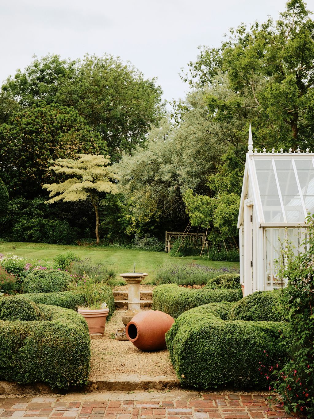 Image may contain Garden Nature Outdoors Grass Plant Park Backyard Yard Fence Hedge Vegetation and Gardening