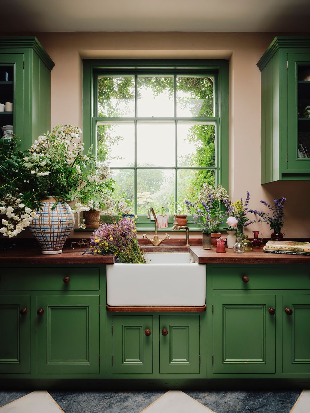 Image may contain Indoors Interior Design Sink Flower Flower Arrangement Plant Book Publication and Window