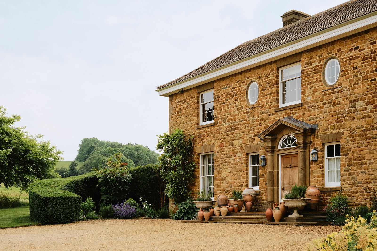 Image may contain Architecture Building Housing Plant House Cottage Person and Manor