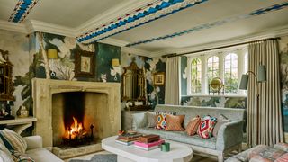 Image may contain Home Decor Fireplace Indoors Architecture Building Furniture Living Room Room Couch and Art