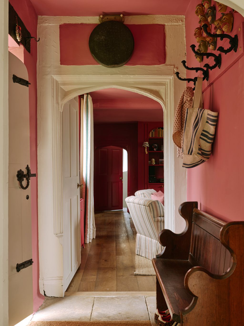 Image may contain Indoors Interior Design Floor Flooring Bench Furniture Wood Couch Architecture and Building