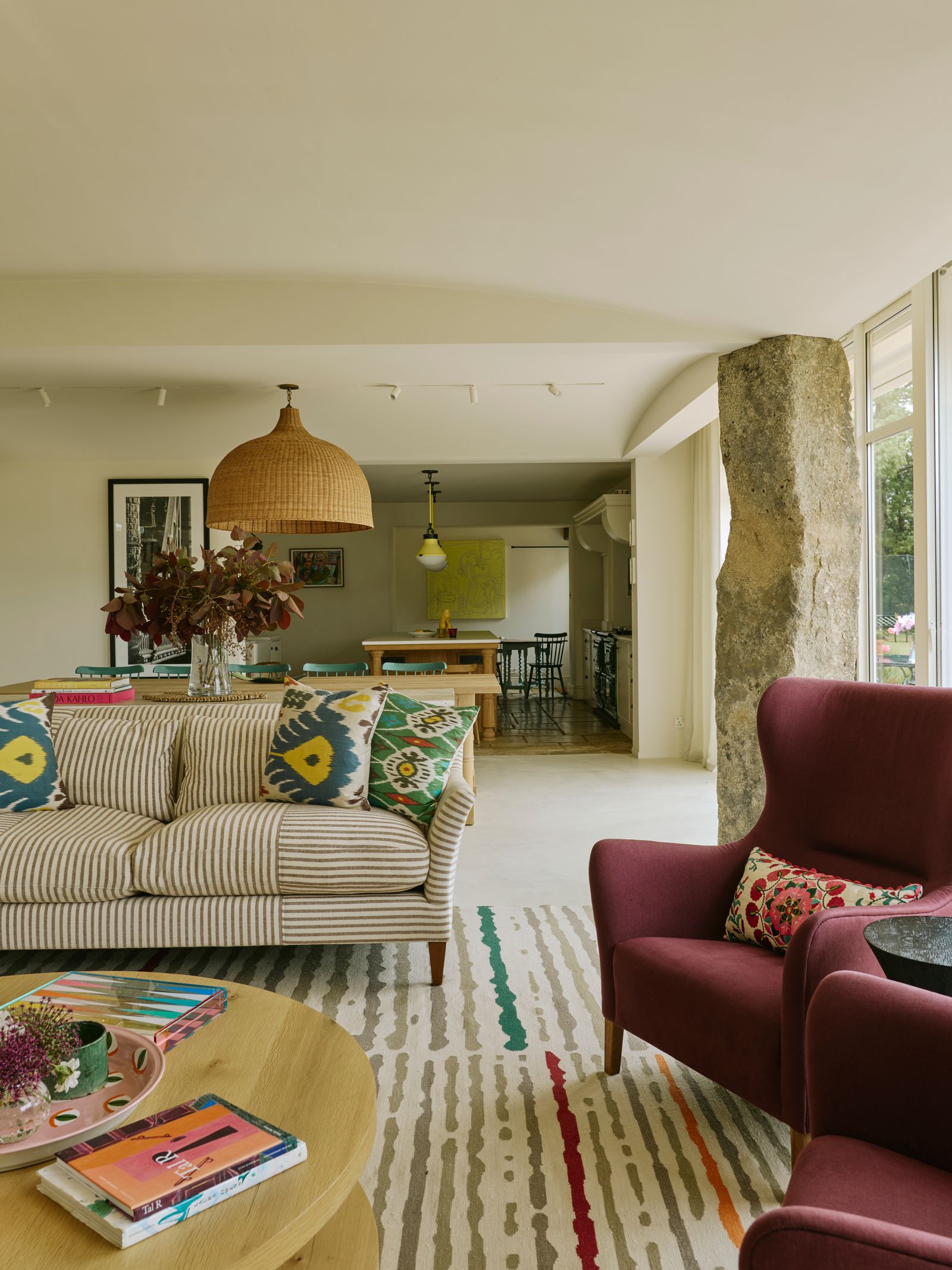 Image may contain Home Decor Architecture Building Furniture Indoors Living Room Room Lamp Couch and Table