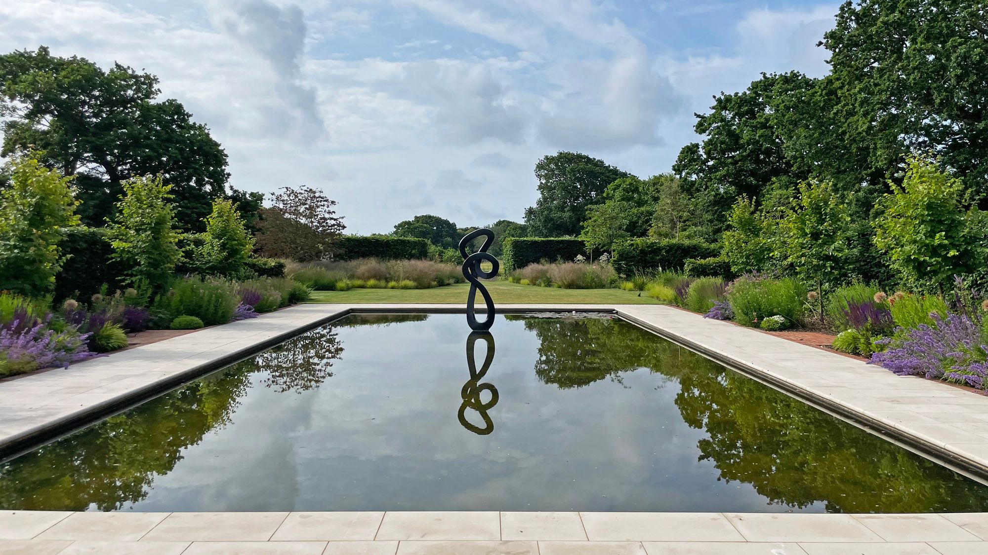 Image may contain: Pool, Water, Garden, Nature, Outdoors, Swimming Pool, Backyard, Yard, Pond, Grass, and Plant