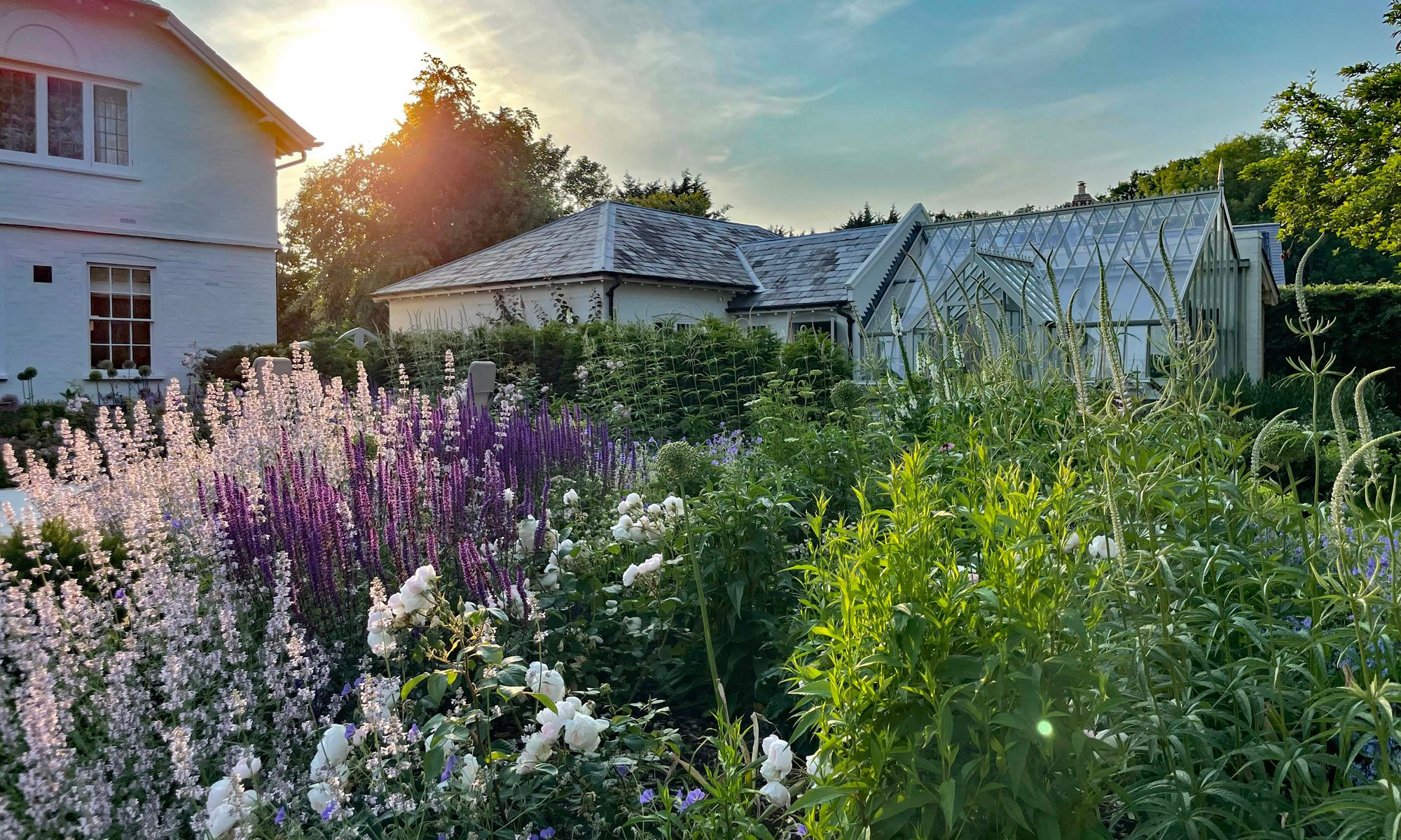 Image may contain: Architecture, Building, Cottage, House, Housing, Garden, Nature, Outdoors, Neighborhood, and Backyard