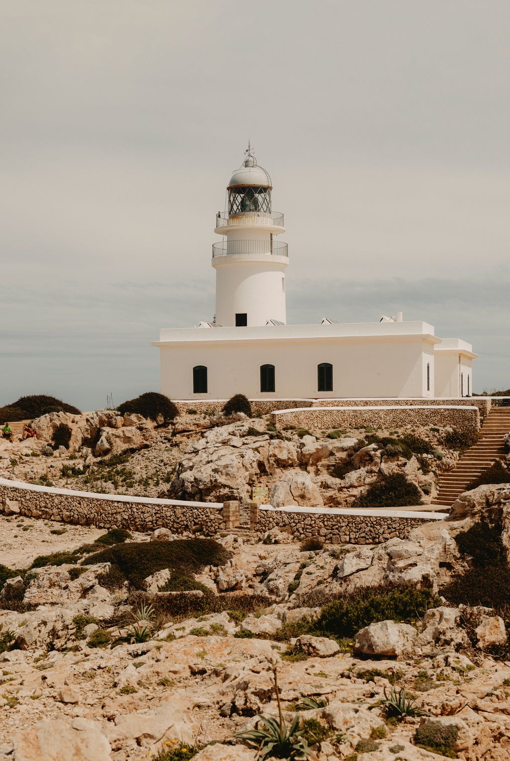 Image may contain Architecture Beacon Building Lighthouse Tower Rock and Person