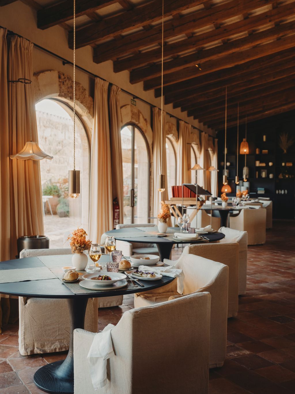 Image may contain Architecture Building Dining Room Dining Table Furniture Indoors Room Table Lounge and Bread