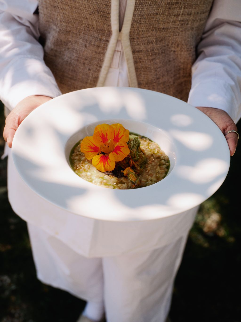 Image may contain Food Food Presentation Flower Petal Plant Accessories Jewelry Ring Meal Person Plate and Dish