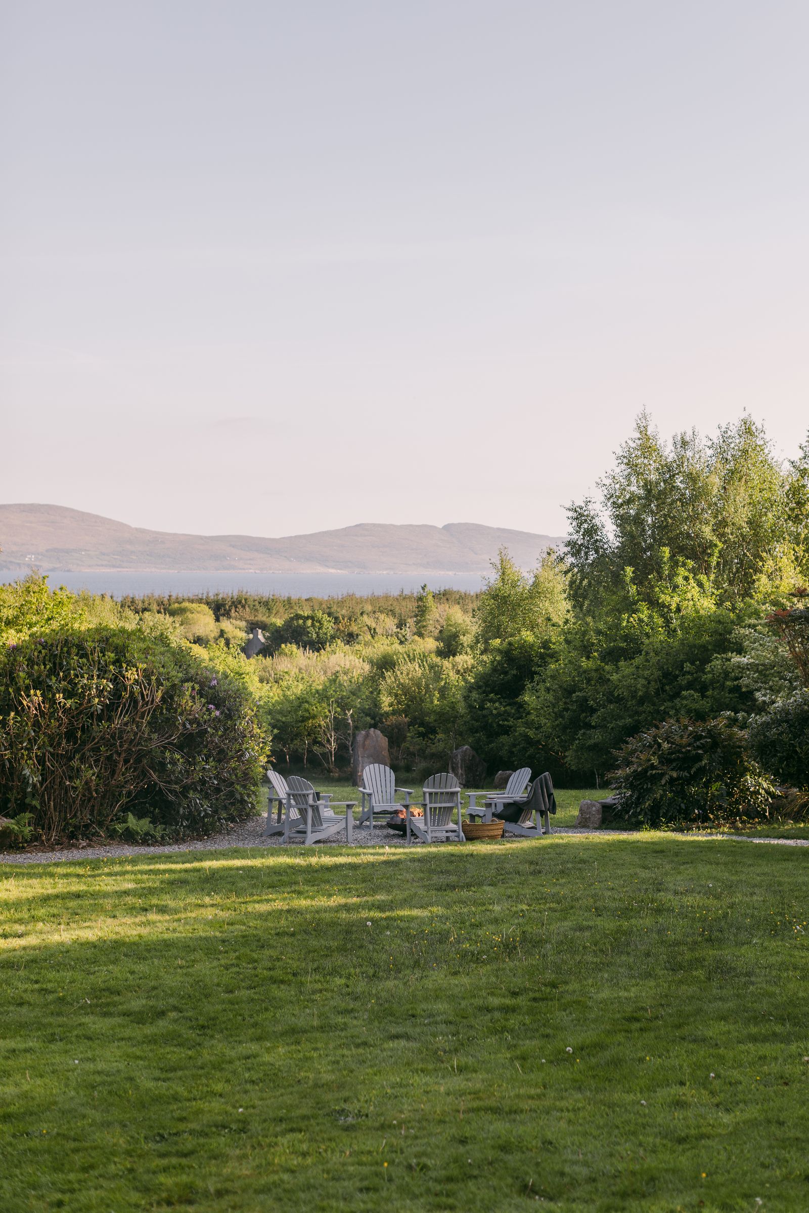 Image may contain Grass Plant Nature Outdoors Park Chair Furniture Lawn Scenery Vegetation Tree and Graveyard